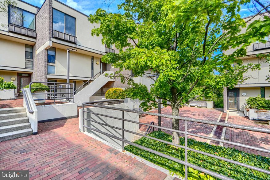 Welcome to this Moshe Safdie–designed townhome in the Cold Spring Newtowne community!  This stylish 3-bedroom, 2-bath home features a smart layout with rare direct garage access and two parking spaces. The entry-level unit offers a welcoming foyer, an updated full bath, and a bedroom.  Upstairs, you’ll find the primary bedroom with an en-suite bath, plus another spacious bedroom.  The open living/dining area flows to a private fenced patio and green space, while the refreshed kitchen boasts newer stainless steel appliances, white kitchen cabinetry, and new LVP flooring. Additional perks include a laundry room, abundant storage, and a bonus concrete pad for hobbies or projects.  Enjoy resort-style community amenities: pool, tennis, walking trails, dog park, playground, and clubhouse. All in a central location close to Mount Washington schools, The Waldorf School, shops, dining, and major commuter routes.