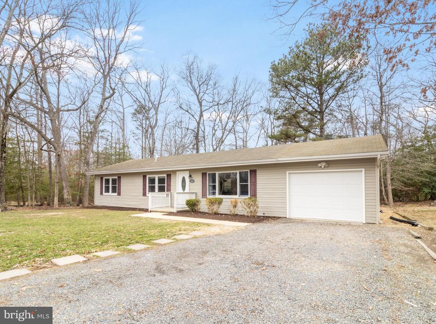 Welcome to this inviting 3-bedroom, 1.5-bath home, featuring a beautifully updated kitchen and timeless details throughout! Step inside to find hardwood floors throughout, adding warmth and character to every room. The spacious living room is perfect for relaxing or entertaining, while the kitchen boasts granite countertops, stainless steel appliances, ample counter space, and a pantry. Enjoy outdoor living in the flat backyard, complete with a patio—ideal for summer BBQs or peaceful mornings with coffee. Plus, a one-car garage provides convenience and extra storage. Located in Chesapeake Ranch Estates, this home offers access to two private community beaches, scenic hiking and biking trails, and other fantastic amenities. Plus, it’s just a short drive to Pax Naval Air Station. A brand new septic system being installed.