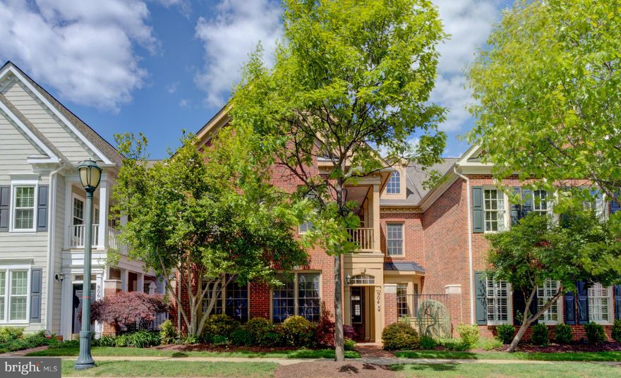 Luxurious & Sophisticated  ***  Experience the elegance of a single-family home with the convenience of townhome living in this highly sought-after Carriage House. This expansive residence boasts a bright, open-concept design, featuring a gourmet kitchen that flows directly into a cozy family room—perfect for entertaining.  The family room has the convenience of a gas fireplace and built in speakers.  The dining room will handle a large gathering,  opens into the living room and has luxurious hardwood floors. 
_____________
The luxurious primary suite is a true retreat, complete with a private balcony, a tranquil sitting room, a walk-in closet, and room for king-sized furniture. Upstairs laundry and a Jack-and-Jill bath for the additional bedrooms add ultimate convenience. Enjoy a private fenced patio, a charming front courtyard, and access to premier amenities including a community pool and center. Perfectly located near top dining, shopping, and easy transit routes.