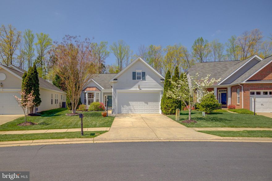 Imagine Luxury One-level Living located in the Premier, Amenity-filled Four Season neighborhood designed for Active Adults aged 55 years +.  This beautifully appointed home has one of the most desirable yards which backs to a private treed area of mature hardwood trees.  The cul de sac street near the entrance to the community is very convenient and walkable to the 21,000 s f Clubhouse which offers a state-of-the-art fitness center, Indoor and Outdoor Pools, Tennis Courts, dedicated Bocce and Pickleball courts, plus cards, clubs, a library, a cyber cafe and billiards are available to our residents.  Venture out on the walking trails located throughout the community. 
This home has been finished with designer interior paint and new carpet in the spacious bedrooms.  You will appreciate the Hardwood flooring, Granite countertops, Stainless steel appliances, Plantation shutters, Bright Bay Windows, and a Gorgeous tray ceiling in the Primary bedroom --This can only begin to tell you how lovely this updated home is! We can't wait to share it with you at our introductory OPEN HOUSE on Saturday, April 19th from 1-3 p.m.  Join us and be the first to Tour!!