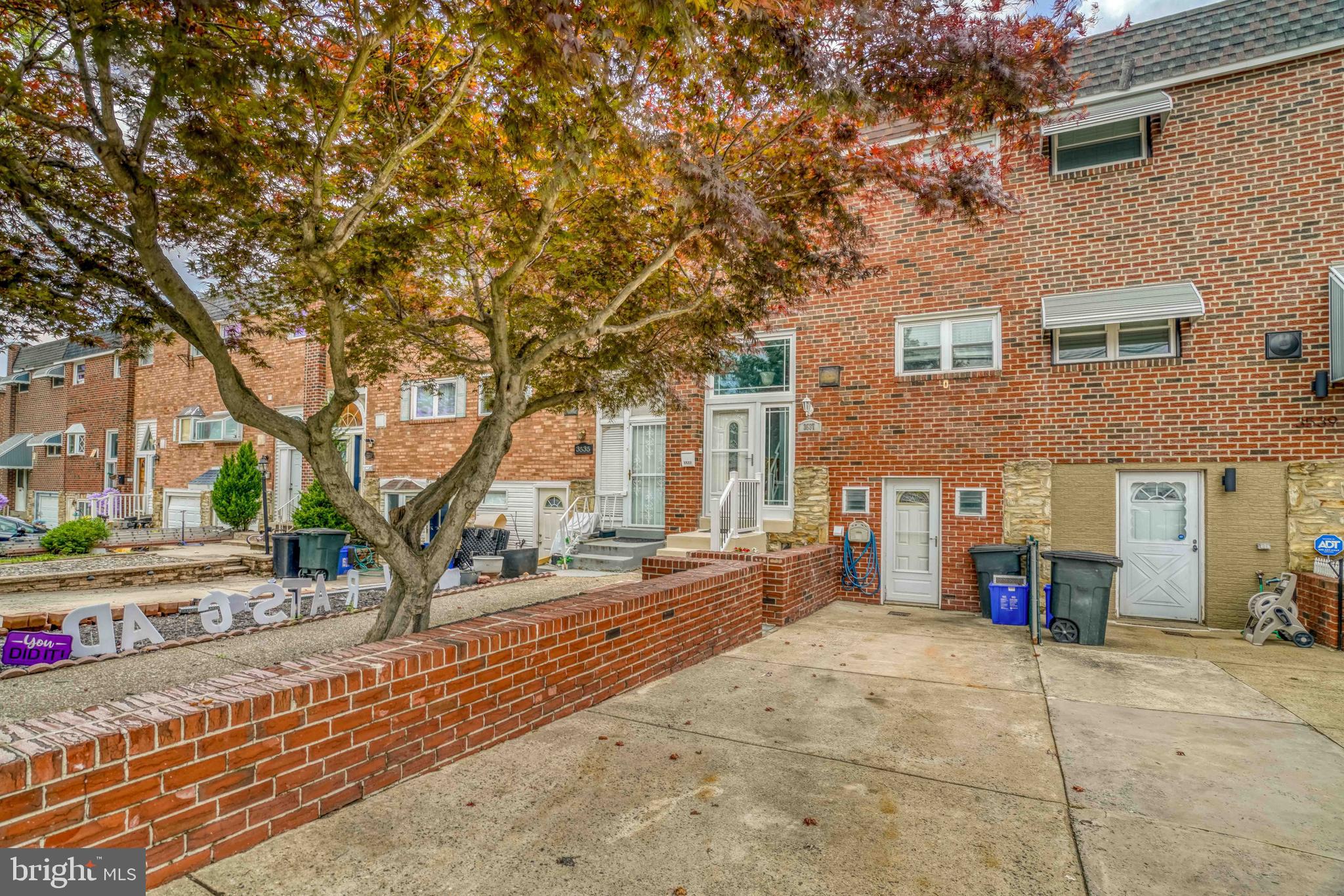Beautiful move in condition townhome in prime Morrell park . Long 2 car front driveway . Brick retaining wall . Basement entry and front entry . Newer front security door and screen door . Luxury vinyl tile mud entry with chandelier and large panel and transom window . Coat closet . Steps up to formal dining room with hardwood floors, ceiling fan light . Large modern kitchen with blue cabinets, tiled backsplash, dishwasher, stainless steel refrigerator, stainless steel gas cooking range , stainless steel sink , garbage disposal, built in stainless steel microwave . Luxury vinyl flooring . Formal living room with recessed lights , hardwood flooring, newer windows. 2nd floor offers bedroom 1 with carpets , ceiling fan light, double closet. Recently remodeled hall bathroom with ceramic tile flooring, subway tiled tub and shower area with pedestal sink , toilet, skylight. Hall linen closet . 2nd bedroom with carpets and double closet . Primary bedroom with carpets , ceiling fan light, full wall closet with barn door style sliders . Finished walkout basement level with carpets , recessed lights, ceiling tiles , security door out to a maintenance free rear fenced yard ,shed , and patio area . Powder room off recreation room . Storage room and hvac closet . Sitting area or office area with new lux vinyl flooring with recessed lights . Laundry area and exit door to front driveway. 18ft wide home .
Come and make this home yours , close and convenient to many shopping centers including Academy and Frankford ave ,Grant ave , Philadelphia Mall , NE airport , public transportation, 95 and Route 1 .