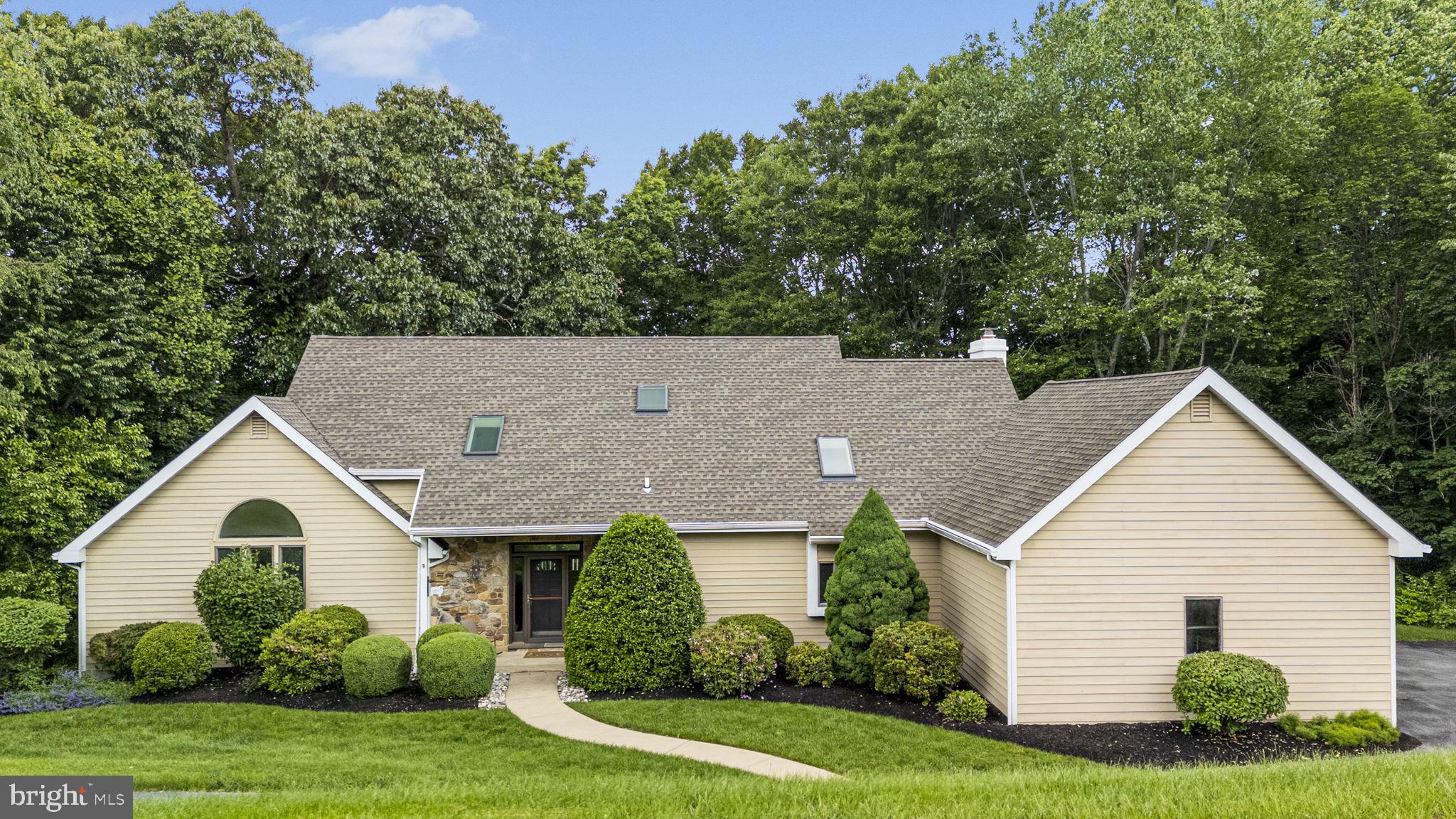 Welcome to 376 Harshaw Drive – where comfort, style, and natural beauty come together in one stunning home located within the award-winning Downingtown School District. Nestled on a serene 1.5-acre lot surrounded by a lush wooded backdrop, this 4-bedroom, 2.5-bathroom single-family home offers the best of peaceful rural living with unmatched convenience to Eagle, Chester Springs, local shops, restaurants, and major roadways. Step inside to a vaulted entryway that sets the tone for the bright and airy atmosphere carried throughout the home. The main-level primary bedroom suite is a true retreat, featuring oversized windows that fill the space with natural light, direct access to the expansive back deck, and a luxurious en-suite bath complete with a soaking tub, large tile shower, and spacious vanity. Just down the hall, relax in the cozy living room with a beautiful fireplace at its heart. The open-concept layout seamlessly flows into a modern kitchen with sleek countertops and stainless steel appliances, ideal for everyday meals and entertaining. Off the kitchen, you'll find a formal dining room perfect for hosting holidays and family dinners, while a second family room provides plenty of additional space for relaxing or gathering with loved ones. A convenient half bathroom and laundry room complete the main floor, offering practicality and ease for both everyday living and guests. Upstairs, you'll find three generously sized bedrooms, each offering comfort and style, with shared access to a full hall bathroom. Head down to the partially finished walkout basement, which is perfect for a media room, home gym, office, play area, or all of the above—plus a large unfinished section for all your storage needs! Outside, the large back deck provides a peaceful sanctuary for enjoying the sights and sounds of nature or entertaining under the stars. Whether you're grilling with friends or enjoying a quiet morning coffee, the wooded views offer a tranquil backdrop year-round. Don’t miss this opportunity to own a move-in-ready gem in a coveted Chester Springs location—offering privacy, space, and a fantastic school district! Schedule your showing today!