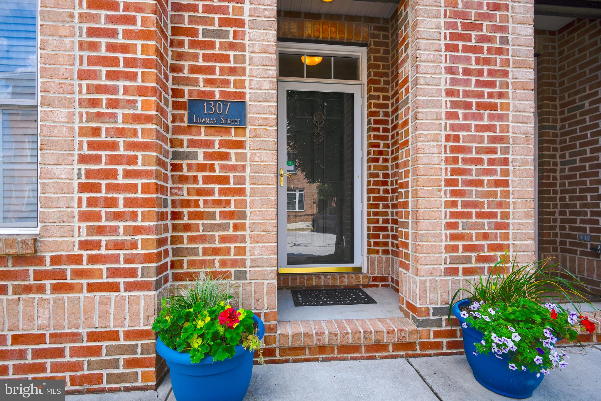 $25,000 PRICE ADJUSTMENT! Best price in Locust Point for a newer home with 2-car garage. See virtual tour for more photos and interactive floor plan. Townes at Locust Point! 3-4 bedroom home in great condition. Entry level BR or office/den with full bath. Open family room/kitchen with deck for grilling. Large master suite with walk-in closet + 2 other bedrooms on upper level. Large roof deck with 360 degree views of downtown, harbor,Silo Point and Domino Sugar sign.