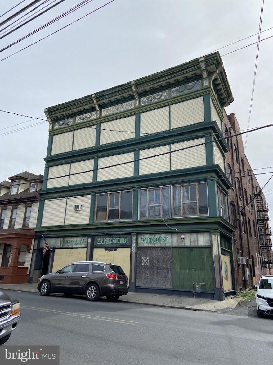 Bring your ideas and imagination to this 26,000+ SF multi-story building. Formerly used as warehouse/storage, the building provides plenty of opportunity for business or residential use. Develop into a residential apartment complex or revert first floor window space into a large showroom for your business venture. Building also has a working freight elevator to move items between floors.