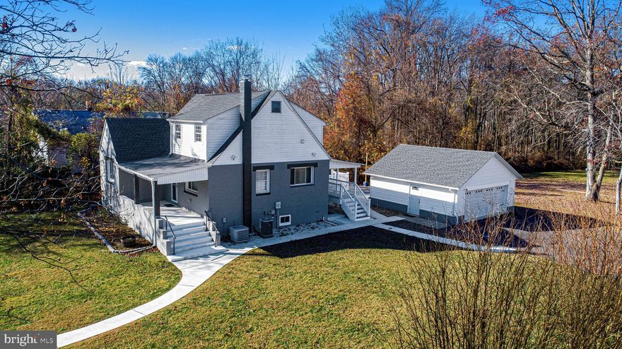 This Middle River gem has been renovated from top to bottom and is only a mile from the river!  From the moment you arrive, the wrap around sidewalk and beautifully landscaped lot welcome you home. Step onto the charming front porch and inside to a bright, inviting living room with a double window that fills the space with natural light. The new LVP floors flows seamlessly into the fully updated eat-in kitchen, featuring granite countertops, marble tile backsplash, farmhouse sink, and stainless steel appliances. A custom coffee bar with double pantries and extra cabinetry provides abundant storage. Enjoy looking out the bay window overlooking the yard. Its the perfect blend of modern comfort and timeless character. Two main floor bedrooms offer convenience and flexibility, paired with a renovated full bath boasting of custom tile. Ascending the wood staircase, the second floor offers three spacious bedrooms, each with walk-in closets and new plush carpet. The upstairs bath is a retreat of its own—beautifully tiled with a jacuzzi tub and glass-enclosed shower. The finished attic beyond serves as a cozy bonus room or think of the walk-in closet this could be! The finished basement extends the living space with a family room and kitchenette, plus a rough-in for a future full bath. With the basement having full waterproofing (2023) and a walk out egress,  the lower level is ready for whatever you imagine next.  Step outside to the enormous composite deck and stamped concrete patio—the perfect outdoor area ideal for entertaining and relaxing. The garage was fully redone in 2023 with new siding, windows, doors, and roof, ensuring years of worry-free use. This home is truly one of a kind    freshly painted throughout, new worry-free LVP flooring, and major systems upgraded for peace of mind: New roof & siding (2023) New oil tank (2023) New electric panel, breakers & wiring, New waterlines throughout, Electrical added to attic & basement , 2nd level HVAC with new heat pump and ductwork. Middle River is close to all major highways and White Marsh is close by for shopping, restaurants and entertainment and only 10 miles from John Hopkins Hospital. With its thoughtful updates, timeless charm, and move-in ready condition, this is a home you’ll fall in love with the moment you step inside!