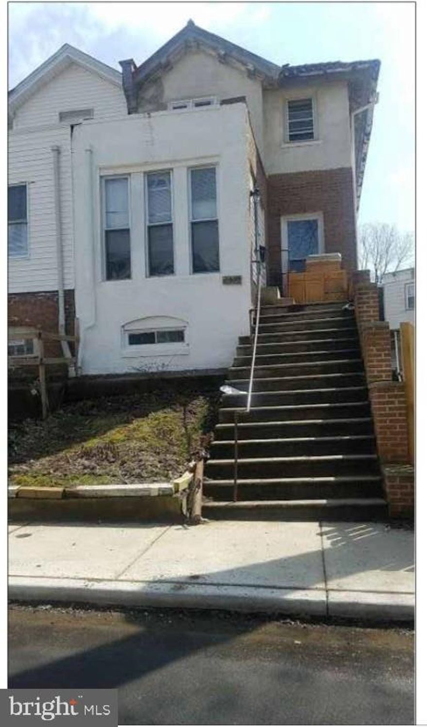 A duplex in a great block with a 3 bedroom 2 bath unit and a 2 bedroom 1 bath unit, ready for completion. It has hardwood floor on two of the levels, electrical run for the top unit, and a stamped architectural drawing. The building face the lot and has lots of windows and light. The attached lot can be built on to maximize your investment, or be used as a private yard with parkings. Perfect for the investors or a savvy homeowner to finish it, live in one and rent out the other. Listing agent has equitable interest.