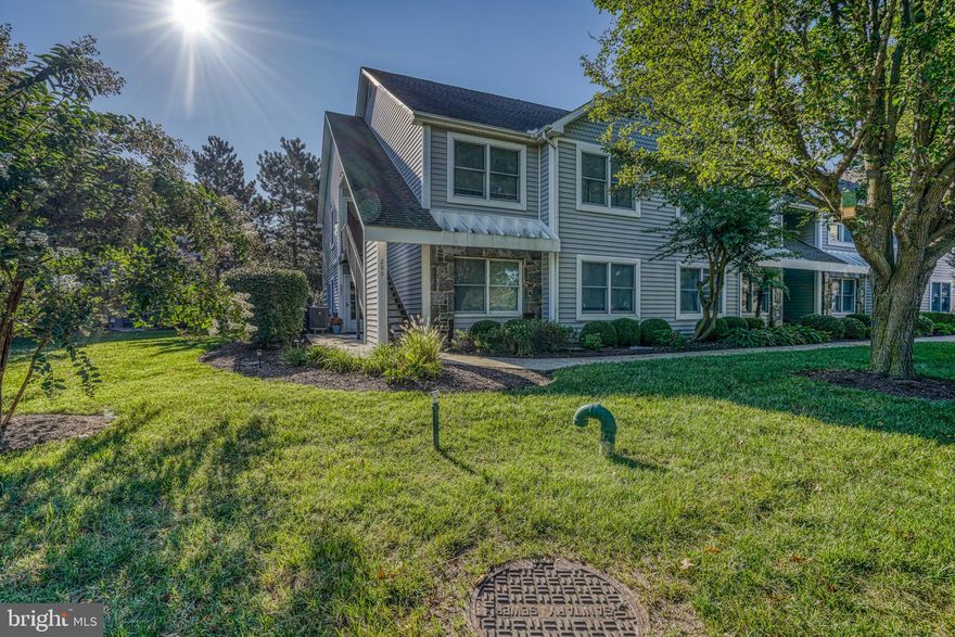 Welcome to this bright and inviting 2-bedroom, 2-bathroom lower-level end unit condo, ideally located in a desirable water-oriented community on Kent Island! The open living and dining area flows seamlessly into a galley-style kitchen with a breakfast bar, now updated with new granite countertops and a new stainless steel stove.

The Primary suite is your private retreat, complete with a walk-in closet and a brand-new custom spa-like shower in the en-suite bath. A second bedroom and full bath provide plenty of space for family, guests, or a home office. Updates within the past few years include laminate flooring in the living areas, hallway, and baths, fresh carpet in both bedrooms and the primary closet, a modern interior paint palette, plus a newer HVAC, refrigerator, and microwave for added comfort and peace of mind.

Bayside residents enjoy resort-style amenities such as a pool, tennis courts, fitness center, and clubhouse with a large party room. The unaffiliated Queens Landing Marina—just steps away—keeps your boat close, while the scenic Kent Island Trail offers miles of walking, jogging, and biking. All of this adds to the relaxed, vacation-like lifestyle of Maryland’s beautiful Eastern Shore!