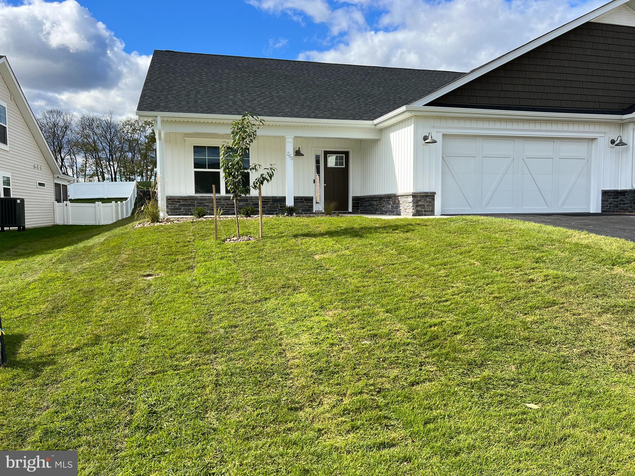 Ready to move in! This brand-new villa built by Panhandle Homes of Berkeley County has everything you need all on one floor. Located near the Spring Mills area, Cardinal Pointe is convenient to I-81 for easy access to everything in Berkeley County plus MD/VA. This home comes finished with a 12x10 covered and screened rear porch with a French door entry, large covered front porch, 2 car garage with additional storage and a professionally sodded and landscaped low maintenance yard! There is NO CARPET in this home, it has been upgraded to LVP flooring throughout making cleaning a breeze. The owner's suite has a large step in shower with a custom cut glass shower door already installed. Common area and a berm behind this home gives you extra privacy. Schedule your appointment to tour this home today!