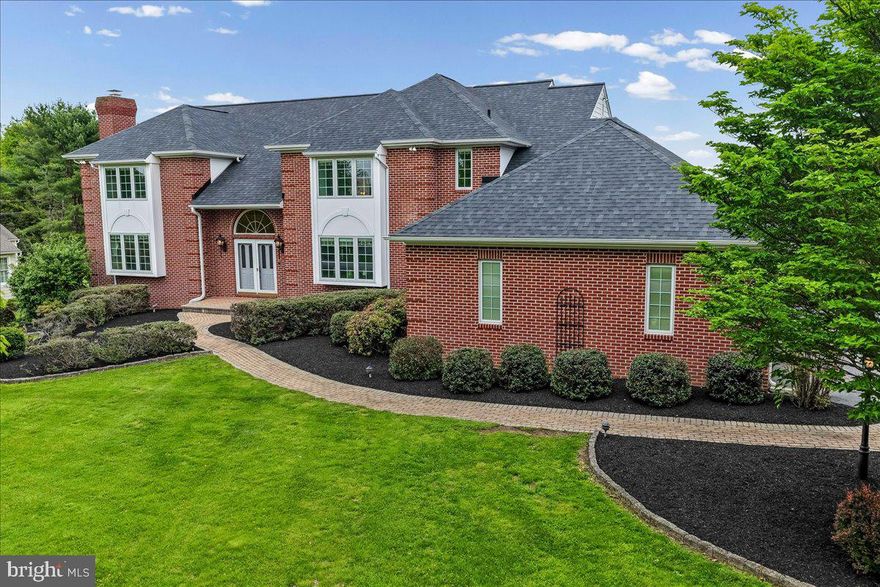 A rare opportunity to own a custom-built showpiece with breathtaking country views and front-row seats to the Longwood Gardens fireworks.
Welcome to this beautifully appointed, custom-built 4 Bedroom, 3 Full & 2 Half Bath brick-front French Colonial, sitting proudly on a spectacular level lot overlooking serene open space with sweeping Chester County views and a truly special setting.
Step inside this grand foyer featuring a graceful, curved staircase and rich hardwood flooring that extends throughout much of the main level. The home offers spacious, light-filled rooms including a formal living room with brick and molded framework fireplace, a private study with custom built-ins, and an elegant dining room highlighted by French doors, detailed moldings, and a charming  boxed window.
The well-designed kitchen showcases granite center island, glass-front cabinetry, and recessed lighting; opening to an impressive family room with inlaid hardwood floors,  a custom entertainment center, and a striking floor-to-ceiling fireplace framed by oversized windows capturing the scenic landscape.
Step outside to the grand patio terrace, perfectly positioned to overlook the tranquil open space which is an ideal setting for entertaining, relaxing, and enjoying the picturesque surroundings.
Upstairs, a hardwood loft provides a versatile space that is perfect for a home office, den, or simply a quiet place to unwind with your favorite book. The serene primary suite features a newly renovated spa-like bath with an oversized custom tile shower, frameless glass enclosure, high-end fixtures, and a freestanding white soaking tub overlooking picturesque countryside. Additional bedrooms are generously sized with ample walk in closet space and neutral finishes.
The walk-out lower level is truly exceptional, offering a possible 5th bedroom, full bath, fitness area, expansive media space, and a remarkable wine cellar.
This home has been meticulously maintained and thoughtfully updated, offering a perfect balance of comfort for everyday living and an elegant setting for entertaining. Recent upgrades include Hardie Plank siding, Pella windows, a newer roof, gutters, downspouts, and updated HVAC systems. Additional highlights include a 3-car side-entry garage (with extra storage capacity), first-floor laundry, two powder rooms, and a 24-hour monitored security system.
Ideally located near Kennett Square Golf Club, Sovana Bistro, and the renowned Longwood Gardens; along with exceptional dining, shopping, and everyday conveniences...this home offers both privacy and accessibility. Situated within the prestigious Unionville-Chadds Ford School District, this move-in-ready residence showcases timeless design, quality craftsmanship, and pride of ownership throughout. Very close proximity to Unionville- Chadds Ford schools.
A truly special offering with unforgettable views; this is a home you'll want to own.