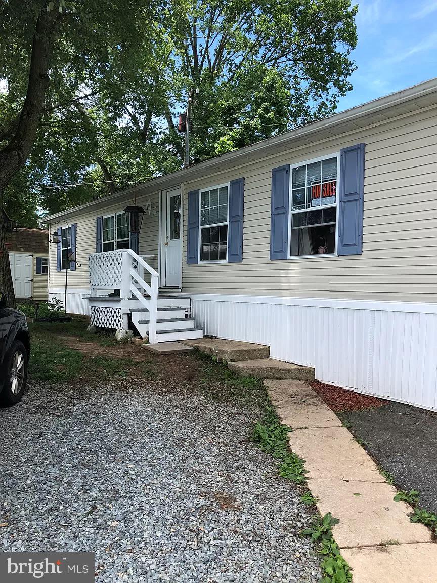 Well maintained Double Wide Mobile Home! You won't be disappointed. The current owners have updated most of the lighting fixtures, installed a new screen door on the main entrance and installed a new kitchen sink and faucet. This 3 bedroom 2 full bath home has laminate wood floors in main living area and carpet in the bedrooms. The kitchen has beautiful white cabinet with plenty of storage. Cathedral Ceiling in the living room and dining room. Nice size deck for entertaining or just hanging out and relaxing. Large shed for storage. The seller is willing to leave the primary bedroom bedframe and dresser, round dining room table and chairs in bedroom #3, couch, love seat, entertainment center, and 2 barstools at the island. The community offers a playground and the monthly fee includes ground rent, trash, and water. Applications to live in the community must be submitted to the Swan Harbour Dell main office.
