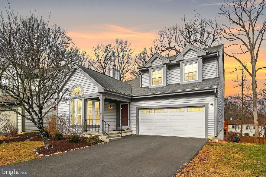 **Offers due by 5pm on Mon 1/12 ** Nestled in the charming Tivoli subdivision, this 4 bedroom, 3.5 bath home offers a welcoming atmosphere and a thoughtfully designed layout. Step inside to hardwood floors, fresh paint throughout (2025), and a formal living room that makes a striking first impression with soaring two-story ceilings, abundant natural light, and a cozy wood burning fireplace, creating a bright and inviting space. At the heart of the home, the gourmet kitchen features rich wood cabinetry, granite countertops, Aqua Tru reverse osmosis water filter, stainless steel appliances, including new LG fridge (2024), and a peninsula with bar seating accented by pendant lighting and a built-in wine fridge. The kitchen flows seamlessly into the family room, making it ideal for everyday living and casual gatherings, complete with a second wood burning fireplace and direct access to the rear deck. The formal dining room provides an elegant setting for memorable dinners, highlighted by large windows and custom shutters. Just beyond is a private study with vaulted ceilings and a conveniently located powder room. Upstairs, the primary suite serves as a true retreat with recessed lighting, a ceiling fan, and two closets with custom organization systems, including a spacious walk-in closet. The spa-like bath features a dual sink vanity, fully tiled walk-in shower, and a separate soaking tub. Two additional generously sized bedrooms share a full bathroom with a tub and shower combo. The fully finished walkout basement offers exceptional flexibility, featuring a large rec room with built-ins that can easily transform into a study area, playroom, or home office. A freshly painted and private fourth bedroom (2022), full bath, and a well equipped laundry room with sink, second refrigerator, and ample storage complete this level, offering endless possibilities to suit your lifestyle. Outside, enjoy summer barbecues or quiet evenings under the stars on the refreshed deck completed in 2025, the concrete patio, and the fully fenced yard surrounded by mature trees. The front garden is enhanced with recently planted double bloom lilacs, a dwarf crepe myrtle, and a butterfly bush for year round color. Recent updates include an HVAC system with upgraded filtration and UV light in 2024 and a water heater installed in 2019. The attached two car garage is wired for a Level 2 EV charger added in 2023, and the repaved driveway from 2023 offers off street parking for up to four cars. Enjoy the low HOA fee and community amenities, including a gym, playground, and scenic walking paths, along with close proximity to Brookside Gardens and Wheaton Regional Park for even more outdoor enjoyment. Don’t miss this!