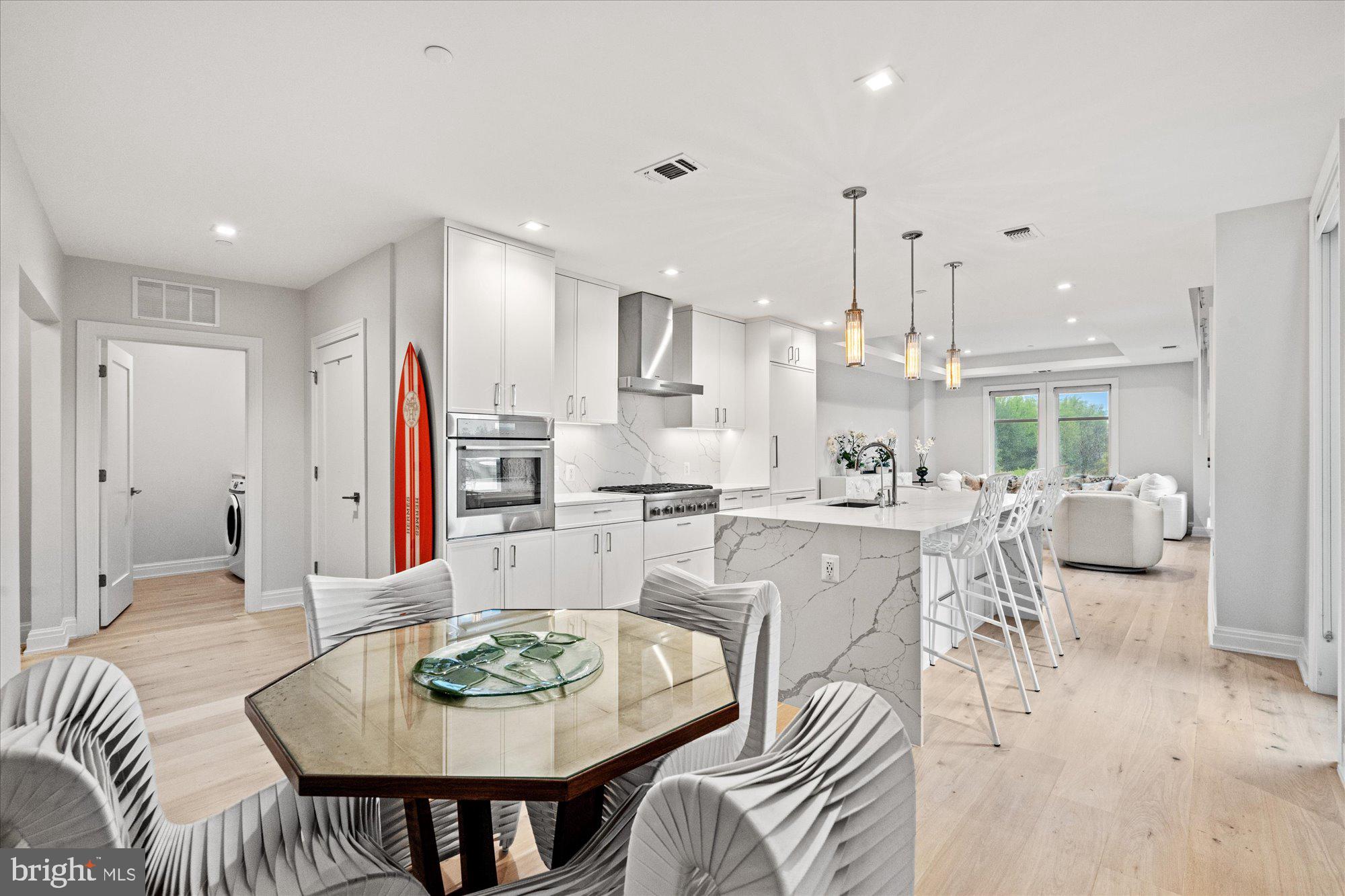 Experience the pinnacle of luxury living in this exquisite penthouse corner unit at the prestigious Ritz Carlton Residences. Spanning 1,565 square feet, this elegant home offers an open floor plan that seamlessly blends sophistication with comfort. The gourmet kitchen is a culinary masterpiece, featuring a stunning waterfall quartz island that serves as the centerpiece for both cooking and entertaining.
Retreat to the expansive primary suite, where you'll find walk-in closets, a dual vanity, a soaking tub, and a walk-in shower. The second bedroom, equally impressive, boasts its own ensuite bathroom for added privacy. A well-appointed half bath and a full-sized washer and dryer add to the convenience of this remarkable residence.
Step outside to your private terrace, a perfect oasis for relaxation and enjoying sweeping views. Building amenities include a valet, 24/7 Concierge, state-of-the-art gym, a refreshing pool, common outdoor BBQ grills and firepits, and wifi throughout the building. With 2 assigned parking spots, this unit offers unparalleled elegance and ease in the heart of Chevy Chase.