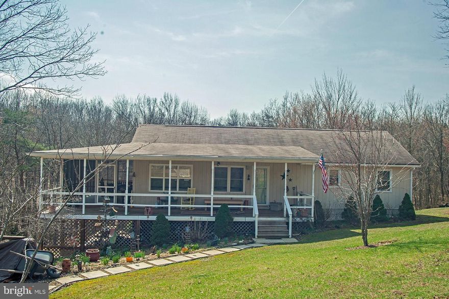 Country setting offers privacy on this 6.22 party cleared, partly wooded acre parcel with a nice ranch home.  One floor living with open floor plan.  Large covered front porch and 12X20 screened porch.  Partial daylight basement for additional living space.  Separate garage/workshop with separate electric and woodstove for heat.  Great spot to retire or raise a family.