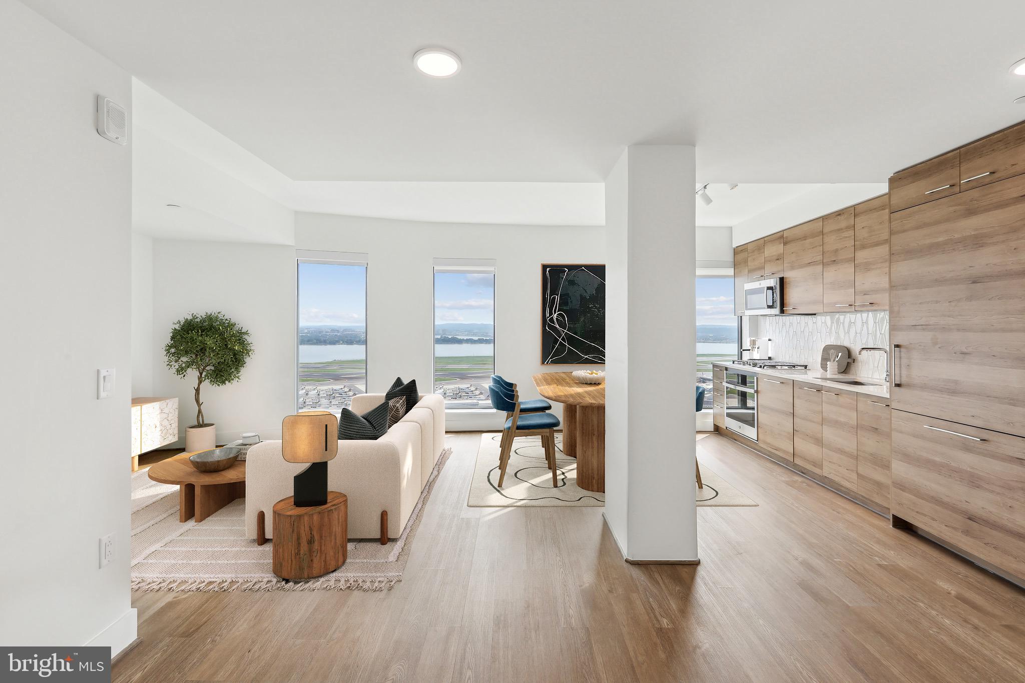 Welcome to unparalleled luxury in this brand-new penthouse. This stunning 2-bedroom, 2-bathroom home boasts nearly 1,200 square feet of sophisticated living space with a large open floor plan that’s perfect for entertaining or relaxing. Revel in the floor-to-ceiling windows offering truly breathtaking panoramic views of D.C. the Potomac and Washington Reagan Airport. Create exquisite meals in your Chef's kitchen with top-of-the-line appliances, quartz countertops, and a sleek modern design.
Enjoy the ultimate lifestyle in this full-service building with 24/7 concierge services, secure package system, state-of-the-art fitness center, Sky Lounge with panoramic views, rooftop pool, and more.
Secure underground parking is available to lease at an additional fee for your convenience.
This penthouse offers a once-in-a-lifetime opportunity to live in an iconic location, just steps from the best that National Landing and D.C. have to offer. Don’t miss your chance to call this luxurious retreat your new home.