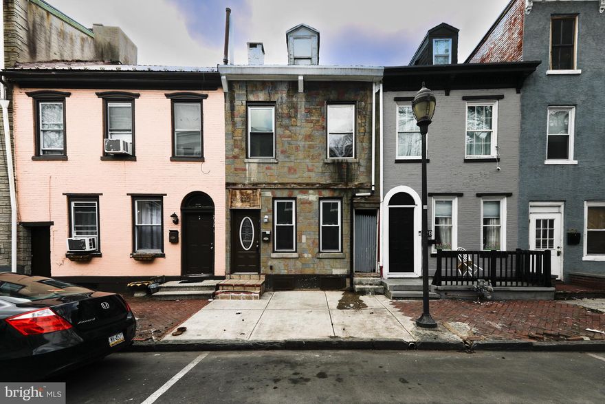 Welcome to this 5-bed single family home in Reading conveniently located at 230 S. 4th St in Reading, PA! Offering 1,340 square feet of living space, this home combines classic city charm with practical updates that make it move-in ready. The main level features newer tile flooring throughout the living room, dining room, and kitchen, creating a clean, cohesive look while offering durability and easy maintenance. The kitchen is enhanced by a decorative tile backsplash, adding style and functionality. A bonus mudroom area adds everyday convenience, providing additional space for storage, coats, and shoes. Fresh paint throughout the home opens up the interior and creates a welcoming atmosphere. The upstairs bathroom features tile flooring and tiled walls, giving the space a finished, low-maintenance feel, and the bedrooms are spacious and bright, with no walk-throughs! Step outside to enjoy a private, level backyard, ideal for relaxing, barbecues, outdoor gatherings and gardening. New concrete sidewalk in front! This property truly delivers and the location offers excellent accessibility with quick connections to Routes 422 and 222, making commuting simple while keeping you close to the city’s amenities. Nearby destinations include Downtown Reading City, Reading Area Community College, the Reading Public Library, Santander Arena and Performing Arts Center, and Reading Hospital, all just a short distance away. 5 bedrooms, 1 bathroom, 1,340 square feet of interior space, a 0.04 acre lot, and annual taxes of $1,366. Schedule your private showing today!