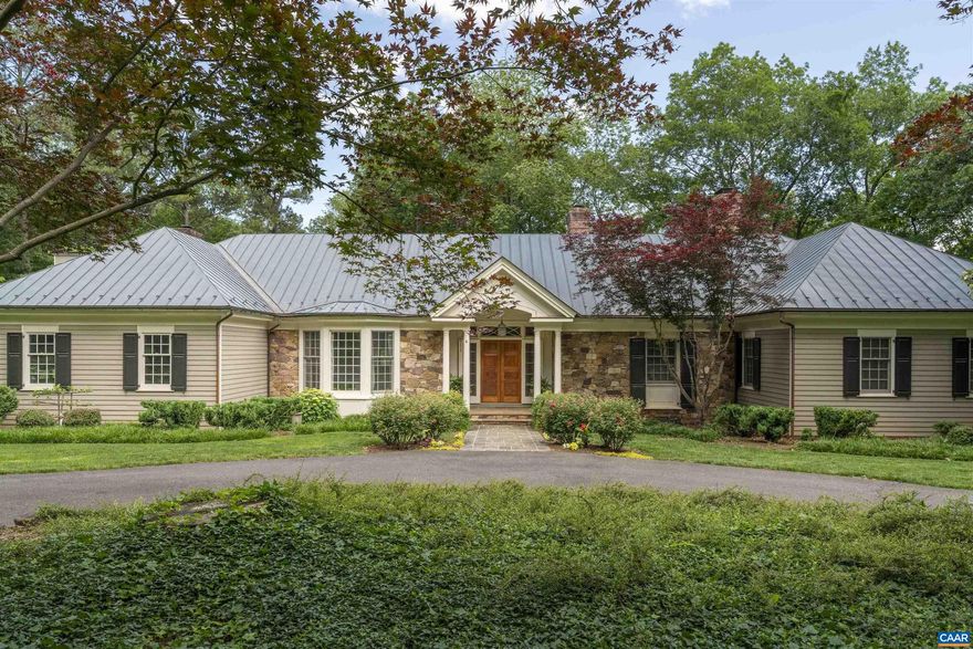 Set on 5.65 serene acres overlooking the protected 175-acre Foxfield Horse Race Course, this exceptional 5,500 sq ft custom home offers sweeping pastoral and Blue Ridge Mountain views from nearly every room. Designed by esteemed architect Henderson Heyward and masterfully built by craftsman John Anderson, the residence features a copper roof, stone and painted cedar siding, and striking architectural detail throughout. Expanses of glass frame the landscape, while the interior blends grand scale with livable comfort?gracious formal rooms, relaxed everyday spaces, and 9 & 10-foot ceilings throughout. Heart pine floors, four fireplaces, and exquisite trimwork reflect superior craftsmanship. The main-level primary suite offers luxurious one-floor living, with ample guest and family space upstairs. Nestled on a quiet dead-end lane just minutes from town, this property is ideal for entertaining or peaceful retreat. Lush gardens, ornamental trees, and a stunning four-falls water feature complete this rare offering.,Glass Front Cabinets,Granite Counter,Painted Cabinets,Fireplace in Family Room,Fireplace in Living Room,Fireplace in Master Bedroom,Fireplace in Study/Library