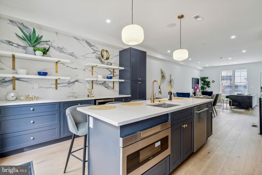 Welcome to 724 S Chadwick Street! This luxury new construction home is located on a quiet block in the highly sought-after Graduate Hospital. Walk to everything! Offering 4 beds, 3 baths, luxury finishes, private roof deck, back patio and a 10 year tax abatement, this home is the best of Philly living! A striking front facade welcomes you into the home with classic brick and stylish metal accents. The main level is completely open concept featuring Oak hardwood floors, soaring ceilings -- brightened up through tall windows filling the main level with natural light. A spacious living area is perfect for hosting guests or watching the Birds / a movie. Past the dining area, your gourmet chef's kitchen features white dove shaker-style cabinets, top-of-the-line appliances, quartz waterfall island and beverage bar with wine fridge. The second level has 2 bright guest bedrooms at opposite ends, sharing a full hall bath and access to the laundry / storage room. The third level is dedicated to your expansive primary suite. Here you'll find a bright and airy retreat with walk-in closets and spa-like bath with rainfall shower and double vanities. Grab drinks from your wet bar and head up to your private roof deck with stunning panoramic skyline views. Outside your door, you will be in the heart of all that Philly has to offer. This home earns a 99 walkscore! Graduate Hospital is brimming with cafes, shops, award-winning restaurants and grocery stores. Just a few steps from Rittenhouse Square and the Schuylkill River Trail! Easy access to the University of Penn, public transport and I-76. Square footage includes above and below grade. Taxes and square footage is the responsibility of the buyer to have verified.
