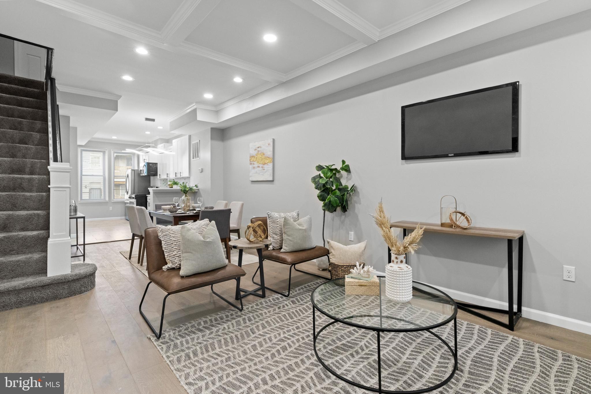Discover the perfect blend of modern luxury and historic charm in this beautifully renovated row home. This 4-bedroom, 2.5 bathroom beauty offers an open-concept living space perfect for entertaining. With quartz countertops, a waterfall island, and stainless steel appliances, the kitchen is a chef's dream. The upper level features 3 sun filled and spacious bedrooms. The completely finished lower level offers an opportunity for additional living area as well as bedroom/office. Conveniently located near a dog park, Starbucks, and Johns Hopkins Hospital, this home offers easy access to everything Baltimore has to offer. Schedule your private tour today and experience the ultimate urban lifestyle. ** property qualifies for Vacants to value booster grant, subject to availability**