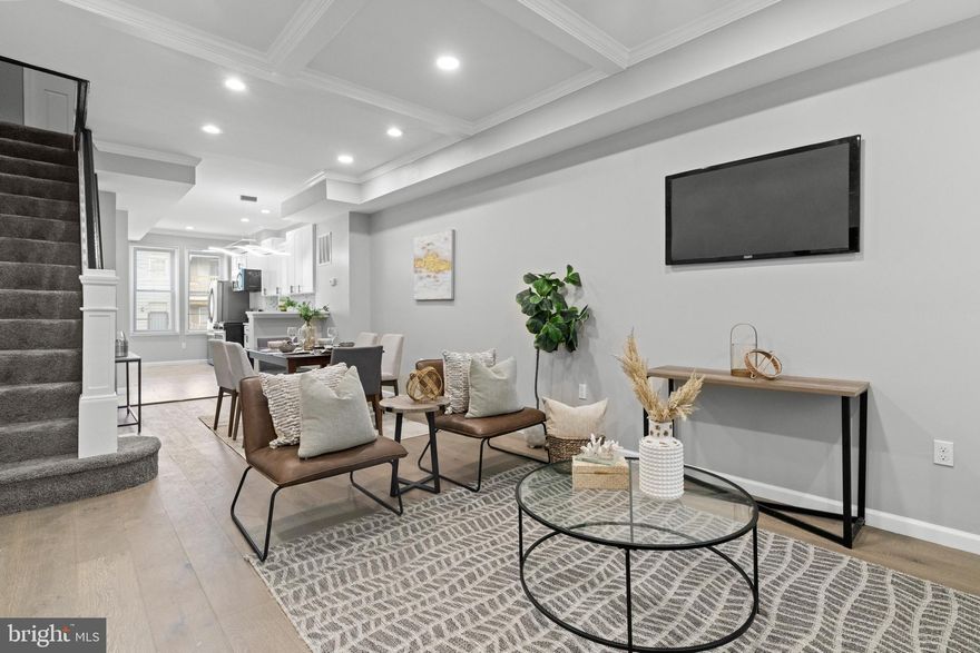 Discover the perfect blend of modern luxury and historic charm in this beautifully renovated row home. This 4-bedroom, 2.5 bathroom beauty offers an open-concept living space perfect for entertaining. With quartz countertops, a waterfall island, and stainless steel appliances, the kitchen is a chef's dream. The upper level features 3 sun filled and spacious bedrooms. The completely finished lower level offers an opportunity for additional living area as well as bedroom/office. Conveniently located near a dog park, Starbucks, and Johns Hopkins Hospital, this home offers easy access to everything Baltimore has to offer. Schedule your private tour today and experience the ultimate urban lifestyle. ** property qualifies for Vacants to value booster grant, subject to availability**