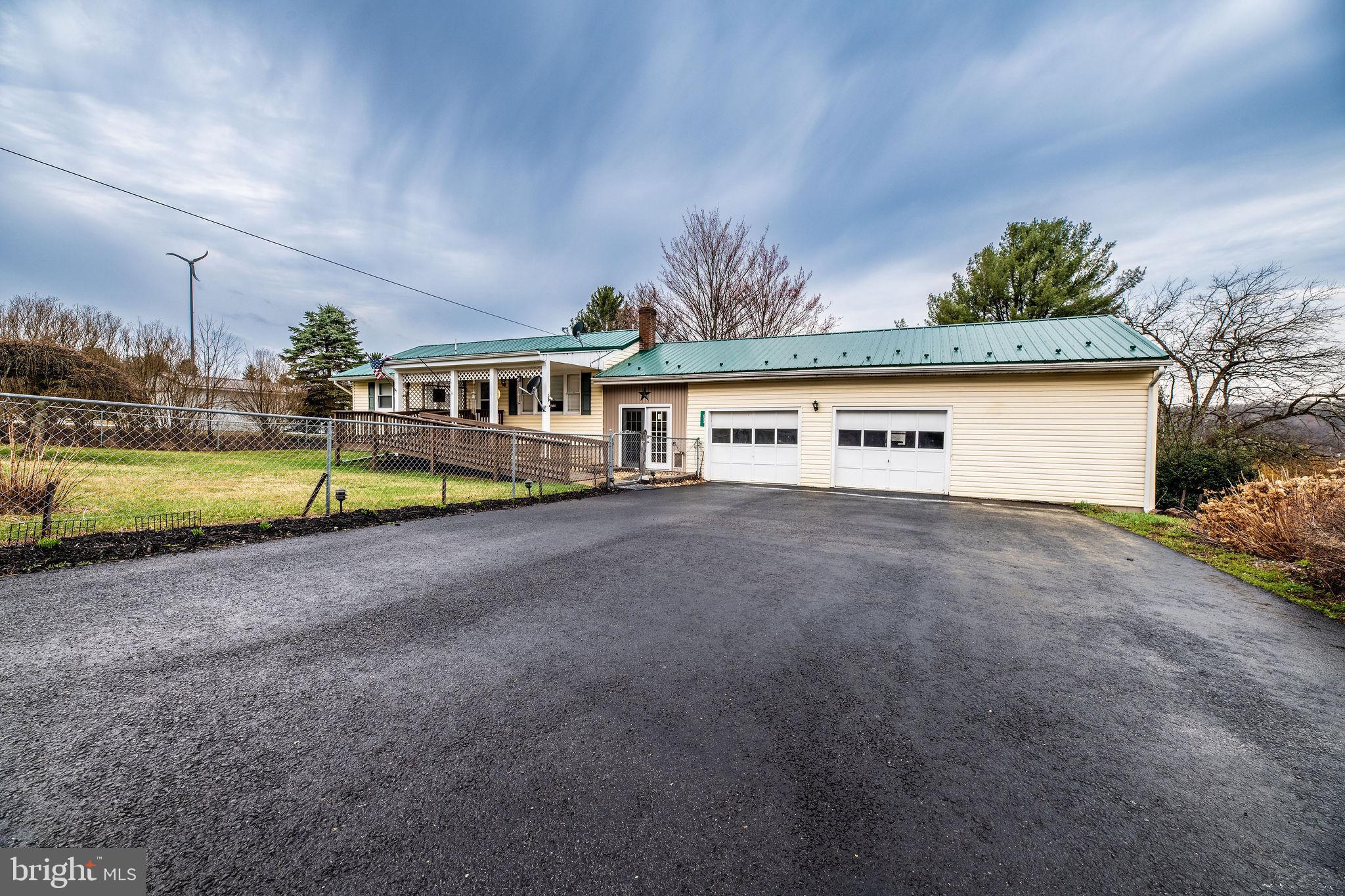 This newly updated 3-bedroom, 1-bath ranch home sits on a spacious 1.4-acre lot in a peaceful country setting. It features a newer roof, a ramp to the front entrance, and an oversized 2-car garage with an enclosed breezeway. Outdoors, enjoy a pavilion, swimming pool, and a fenced yard, offering plenty of space for relaxation and entertainment. This charming home combines modern comforts with a serene rural lifestyle.