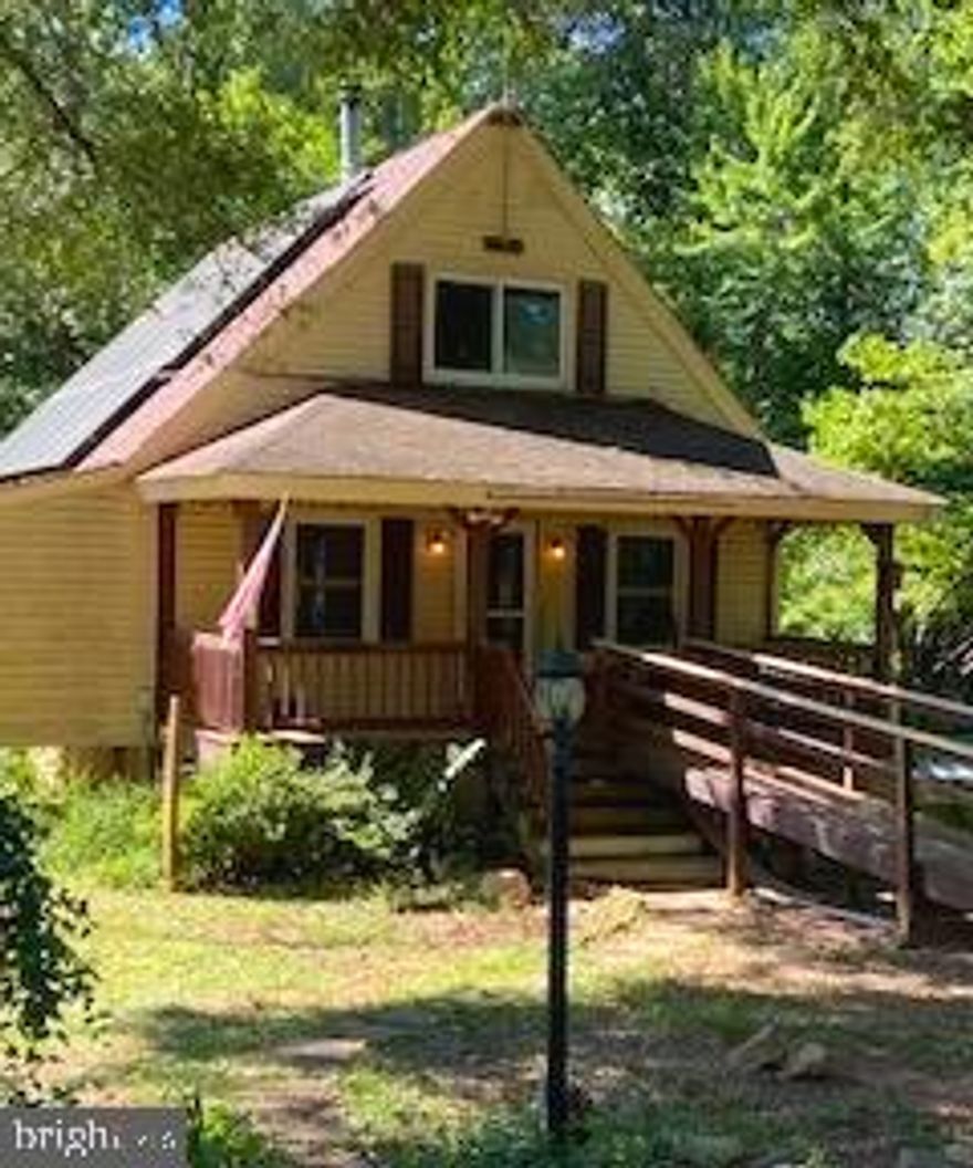 Contractor's Special with Serious Upside! 4.4-acre parcel. Quiet. Serene. No HOA. 
* Key highlights include: Solar panels already installed – enjoy remarkably low electric bills (per owner) thanks to Virginia-friendly solar incentives and net metering benefits that can slash utility costs year-round.
* Massive oversized steel garage on a solid concrete platform – ideal for vehicles, equipment, workshops, or storage.
* Fenced yard for pets, gardening, or added security.
* Surprisingly nice, updated kitchen – a bright spot ready to enjoy while you tackle the rest.
* Land runs down to Mine Run Creek – imagine creek-side relaxation, potential recreation, or enhanced privacy in this wooded, serene spot.
* Chickens and other Farm Animals = AOK
* The home itself is a true fixer-upper:  Flooring needs attention in places, bathrooms await updating, and other areas require TLC – but the bones are solid, and the value is here. This is a classic contractor's or investor's special with room to create equity through renovations.
* Plenty of options for buyers who want to build equity fast – consider a construction loan, USDA Construction-to-Permanent (ideal for eligible rural areas like this), or FHA 203(k) rehab loan to finance both purchase and improvements in one package. 
* Broker's Estimation of Value: I have been at this work for 25+ years. This property, in renovated condition, is easily $500K+ .
* Owner will remove all the bric a brac, tools and stuff laying around prior to closing.