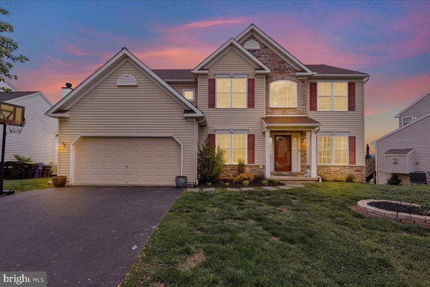 Tucked along the edge of sought after Lincoln Meadows, this beautifully maintained home captures sweeping pastoral views, open green space, and direct access to the community walking trail while offering the convenience of nearby schools, shopping, and major roadways within the Ephrata Area School District. Peacefully positioned on the outskirts of the neighborhood, the setting delivers a rare sense of privacy and calm.
A sunfilled vestibule welcomes you into an inviting interior framed by expansive  windows, a gracious sitting room, and an elegant formal dining area designed for both everyday living and memorable gatherings. Just beyond, a versatile den offers exceptional flexibility as a home office or potential main level bedroom.
The dramatic two story living room is anchored by soaring ceilings and flows seamlessly into the well appointed kitchen, creating an airy, connected atmosphere ideal for entertaining. Step outside to the oversized freshly painted deck where panoramic countryside views and the neighboring walking path create a truly picturesque backdrop for morning coffee or evening sunsets.
The main level is thoughtfully completed with a two car garage, convenient laundry area, and powder room.
Upstairs, the spacious primary suite serves as a private retreat featuring a walk in closet and ensuite bath with soaking tub, separate shower, and dual vanity. Three additional generously sized bedrooms and a full guest bath provide comfortable accommodations for family and visitors alike.
The fully finished walk out lower level offers remarkable versatility with endless potential for entertaining, extended family living, guest quarters, or recreation space. Highlights include a built in bar with kitchenette, walk in pantry, multiple auxiliary rooms, a full bathroom, and direct outdoor access.
Blending scenic surroundings with functional living spaces and an exceptional location, this Lincoln Meadow residence offers the perfect balance of comfort, flexibility, and peaceful everyday living.