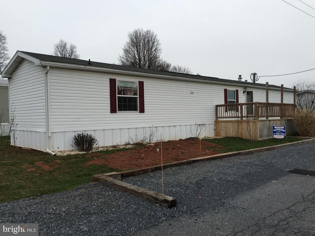 Lovely home in Brookside Community, just outside of Bowmansville. Kitchen has gas range, refrigerator, DW and laminate floor. Living room with hardwood floor. MBR w/walk-in closet & add'l closet, hardwood floor, full Mbath w/garden tub. Affordable lot rent, only $357/month which includes water, sewer & trash.