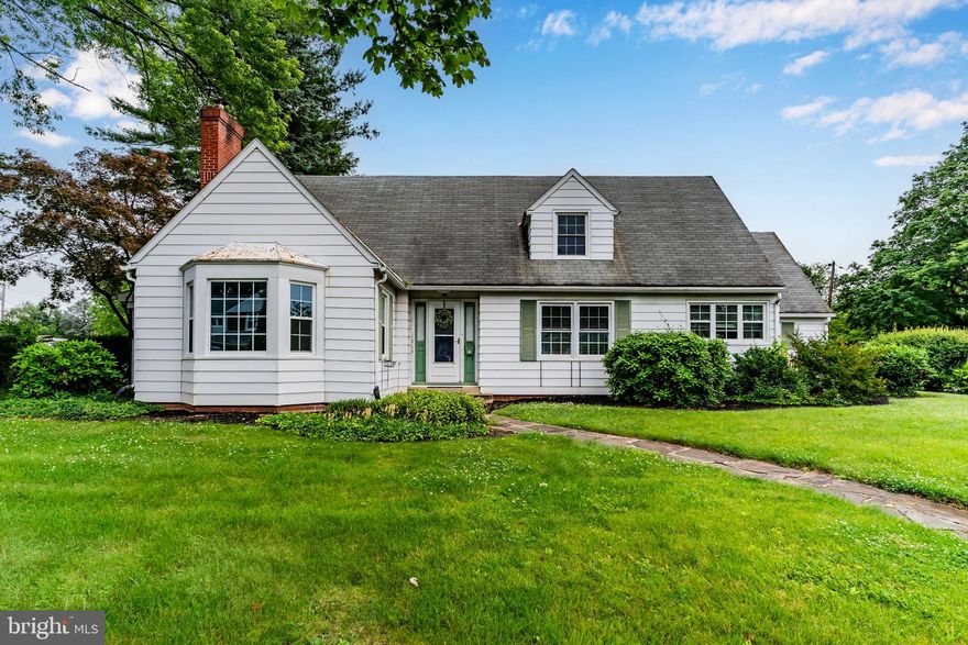 Welcome to this timeless Cape Cod-style home, nestled in the heart of Hampden Township on a desirable corner lot. Conveniently located just minutes from Route 581, Carlisle Pike, and a variety of locally owned restaurants, this home offers both character and convenience. Step inside to discover a thoughtfully customized and expanded kitchen featuring a striking tiled backsplash, custom wainscoting, recessed and pendant lighting, and an abundance of natural light through numerous windows. The living room showcases original hardwood floors and a woodburning fireplace, perfect for relaxing evenings. The first floor offers a primary bedroom and a versatile office space, while the second level includes 3 additional bedrooms, all with hardwood flooring, and a beautifully renovated full bathroom. Enjoy outdoor living in the screened-in porch or the aluminum-fenced backyard, complete with two storage sheds. Additional highlights include a one-car garage, a charming breezeway, and attic storage. With its blend of thoughtful updates and classic appeal, this home offers enduring charm in a sought-after location.