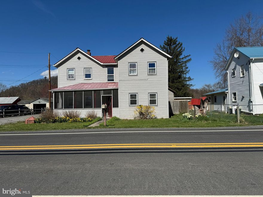 1909 era colonial located at 5130 Central Ave in Great Cacapon.  Lots of Potential.  Home features 3 bedrooms, 2 bathrooms, 2 kitchens & oversized detached garage.  Nice back yard.  Close to Cacapon River access for recreational activities.