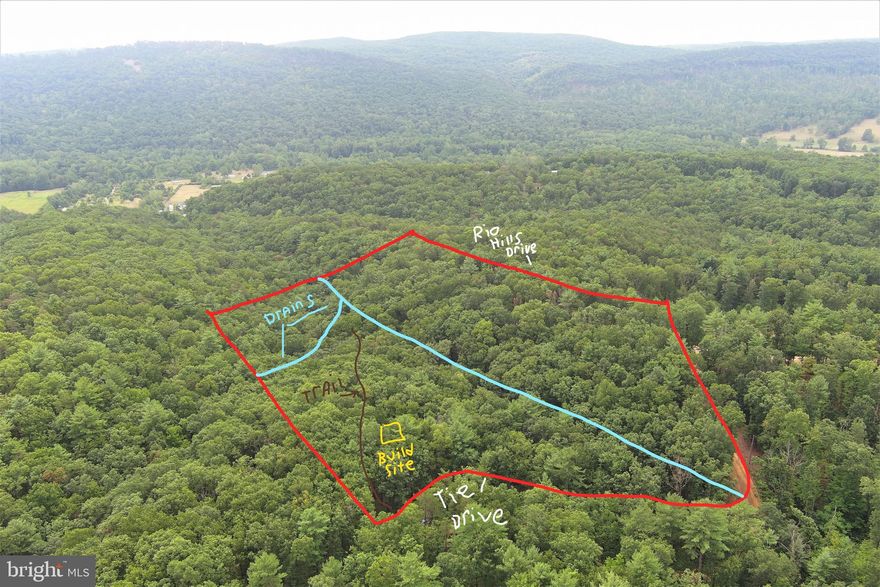 PRACTICALLY UNRESTRICTED.....8 WOODED ACRES IN THE SMALL DEVELOPMENT OF "RIO HILL" WHICH HAS VERY MINIMAL RESTRICTIONS AND A MINIMAL HOA FEE OF $75 PER YEAR......ASIDE FROM HAVING A JUNKYARD, COMMERCIAL BUSINESS OR RE SUBDIVIDING THE LOT.....YOU CAN PRETTY MUCH DO WHATEVER YOU WANT! VERY PRETTY LAND WITH 2 RIDGES AND 2 HOLLOWS, TOWERING HARDWOODS, 2 WET WEATHER DRAINS AND ELECTRIC AROUND 2 SIDES OF THE PROPERTY. VERY NICE BUILDING SITE OFF TIE DRIVE ON A RIDGE THAT WILL PROVIDE NICE WINTER VIEWS OF NORTH RIVER MOUNTAIN. ESTABLISHED ATV TRAIL GENTLY FOLLOWS THE RIDGE DOWN INTO THE BIG HOLLOW, EASY TO GET AROUND ON AND NOT TOO STEEP. THE BIG HOLLOW PROVIDES A GREAT BACKSTOP FOR SHOOTING AND IS AN EXCELLENT DEER CROSSING. HUNT, CAMP, SHOOT, ATV'S, TINY HOME, RV, SINGLE OR DOUBLE WIDE.....A SHORT DRIVE TO PUBLIC HUNTING & TROUT FISHING........ONLY 2 HOURS FROM DC! IF YOU'RE LOOKING FOR SOME LAND TO DO YOUR OWN THING ON AND HAVE A GOOD TIME ON THE CHEAP.....THIS ONE'S A SLAM DUNK!