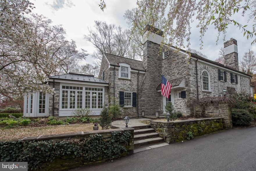 Rarely does a home become available which offers the best of everything. Located on a desirable private lane in the heart of Lower Merion, this stunning house provides a sanctuary combining modern conveniences with timeless elements epitomizing Main Line tradition. Built in 1920, the classic Pennsylvania stonework, lush gardens, extensive hardscaping, and elegant pool, all in impeccable condition, are hallmarks of the exterior of the house. Beautiful flagstone patios create multiple outdoor living spaces which are accessible from many of the downstairs rooms. The interiors are also in pristine condition. Gleaming hardwood floors were recently refinished by the current owners and are found throughout. The first floor is highlighted by large, gracious rooms with crown moldings, and large windows which permit sunlight to flood the interior spaces, all of which have been designed and decorated with a nod to the past combined with current trends. The living room features a newly installed coffered ceiling and large fireplace. The recently renovated white chef s kitchen with stainless appliances, custom tiled backsplash, and marble countertops provide plenty of space for food preparation and dining. The kitchen floors provide radiant floor heating, as do the floors in the spectacular solarium off of the living room. An inviting dining room and comfortable sitting room adjacent to the eat-in kitchen boast sophisticated built-in cabinetry. Upstairs the master suite has been updated to include fully outfitted walk-in closets and spacious marble bathroom with large walk-in shower and double vanities. There are three more family bedrooms on the second floor, one with fully updated en suite marble bathroom. Two more family bedrooms share a jack and jill bathroom. All of the bathrooms on the second floor have been fully renovated to exacting standards. A convenient upper-level laundry room is also found on this floor. The third floor has two bedrooms and two updated bathrooms. The current owners thoroughly reworked the basement, creating a sophisticated refuge with custom built-ins, bar, and fireplace. The property upgrades are too many to mention here but include complete waterproofing system, security system, full house generator, new pool coping and heater, and exterior lighting. This spectacular house in award winning Lower Merion school district is conveniently located in close proximity to public transportation, major highways, Center City Philadelphia, and houses of worship.