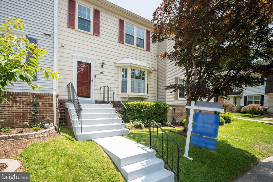 Enchanting town home with many improvements and thoughtful owner upgrades plus a superb location just off the Fairfax County Parkway and an easy drive to tons of shopping, restaurants and other amenities and just  7 minutes from Metro-rail. The interior of this wonderful home has an outstanding layout plus many features and upgrades highlighted by: a warm and inviting  kitchen w/granite counters, SS appliances and a wall removed - enabling open views of the family room and back patio; upscale hardwood flooring spanning the main and upper levels; renovated bathrooms throughout; a fully finished lower floor with custom tiling, bathroom, spacious recreation room (perfect for movie and game nights, plus a separate laundry/storage room. Finally, the charming rear yard is private, quiet and offers an expansive patio and raised garden. Enjoy your visit!