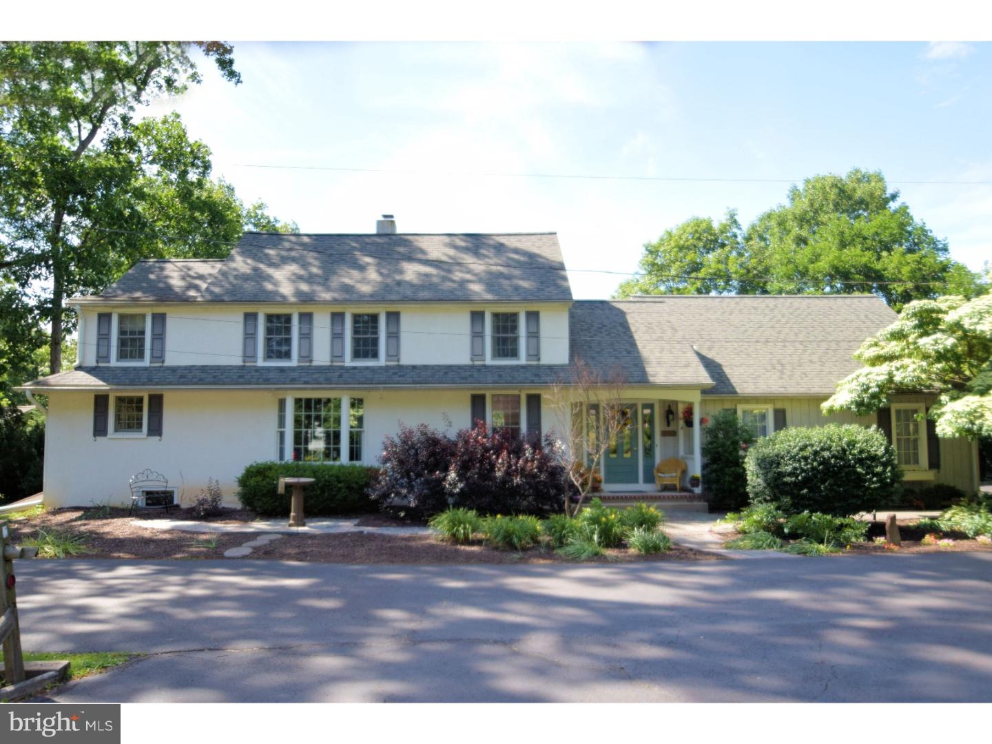This Elegant Country Manor home, dating back to 1930, offers a wonderful ambiance of both old and new. Charm, dignity and character best describe this completely renovated Bucks County Farmhouse.  Located down a private lane, and surrounded by 2.5 acres of bucolic pasture, you'll find this one-of-a-kind property. For starters, enter into the gracious foyer and you'll immediately notice the elegant blue stone entry floor and lots of natural sunlight. As you move into the breakfast and dining rooms, you'll find gleaming hardwood floors and spacious rooms, all flooded with more natural light. The large kitchen offers beautiful tile floors, oak cabinets, granite counters including a convenient breakfast bar, and a stunning glass tile back splash. Stainless appliances complete the kitchen.  From there, you will be able to see into the family room which offers many windows for you to view the beautiful outdoor surroundings. This room is like a sun room during the summer months, and, with the beautiful blue stone fireplace with wood burning stove, you will also enjoy the cold winter months here.   Upstairs you'll find 3 full baths, all are completely renovated with crisp, clean colors and accents. The main bedroom with ensuite bath offers a relaxing spacious haven with more natural light, and 4 closets.  The ensuite bath has been completely redone and offers a large glass enclosed shower and double bowl vanity. You'll also find the 4th bedroom has an ensuite bath. This suite can be used as a convenient home office, or guest quarters.  Outdoors, you'll find Mother Nature at her best!  The 2-tier trex deck offers 360 degree views of this lovely homestead. Enjoy sitting on the deck taking in the view. Or, if you prefer, relax in the inviting hot tub which awaits you at any moment you desire to step in.  Other outdoor relaxation options include sitting around the private backyard fire pit. This area is surrounded by large trees and offers a secluded setting for private gatherings.  You also have the option of sitting under the English-inspired, Wisteria-draped outdoor patio if you so desire. All in all, you will have many options to relax and enjoy yourself in this amazing property! Seller is also offering a 13-month home warranty to the buyer. Don't wait another minute,move into this dream today!