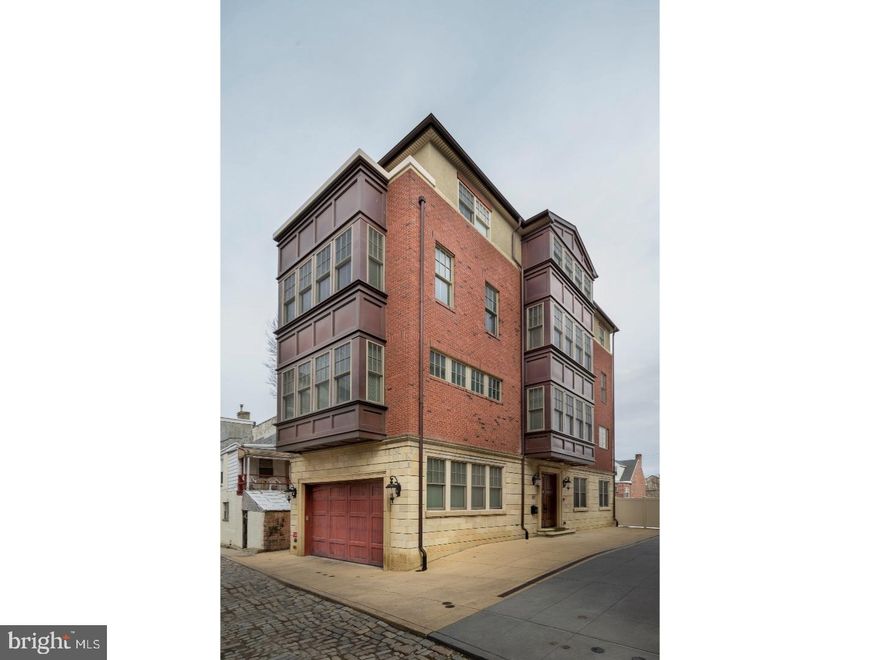 Come revel in this custom, free-standing, 5600sqft, 4 story, to-die-for masterpiece featuring 4 bedrooms, 4.5 baths, 2 dens, 2-car garage, 5 outdoor spaces, 4 exposures allowing for for 87 windows, custom wine cellar, 2 wet bars, santos mahogany flooring, crystal-like door handles, elevator and so much more. Impeccable and unmatchable taste, quality, materials, detail and workmanship is evident at every corner. Mahogany doors greet you into the carrera marble foyer, where you'll find the library, highlighted by a coffered ceiling, gas burning fireplace, wall of built-ins and doors out to the yard. A wall of windows allows immense light to flood the home as you travel the staircase up to the 2nd floor. The living room offers a massive bay window, soaring ceiling, gas fireplace with wood & travertine tile mantle, and a half bath. Enjoy hosting dinner parties in your center dining room and preparing all your meals in the gorgeous custom kitchen, dressed in carrara marble, glass tile, stainless steel (Wolf, Subzero & Bosch) and eloquently finished with a farm sink, wine cooler, expansive island, sitting nook with desk & doors out to a covered porch. The 3rd floor features 3 bedrooms, one could be a den/office, and one with a walk-in closet, covered terrace and an en-suite bath with marble flooring, Victoria Albert new clawfoot tub and granite vanity with vessel bowl sink. Off the hall you'll find a laundry room, and a full bath complete with marble flooring, all-tile stall shower and an ornate dual vanity. The 4th floor begins with an open foyer offering a wet bar, wall of windows and a rooftop terrace with incredible sunset views. Find the ultimate getaway in your private bedroom suite, complete with a vaulted ceiling, gas fireplace, 2 walk-in closets and a brilliant full bath with carrera marble, jacuzzi type tub, ornate dual vanity, spacious all-tile stall shower and watershed. Sliding glass door leads out to a rooftop terrace with expansive views. The beautifully finished lower level boasts a gas fireplace, wet bar and a full bath. Retrieve to your personal, custom detailed wine cellar, suitable for approx 750 bottle with wood trim, stone wall, air purifier and exhaust system and complete with built-ins, shelving, wet bar, wine cooler and custom wood countertop. This remarkable home is nestled on a dead-end, cobblestone block in the heart of Queen Village, just a stroll from the Shot Tower, Headhouse Square, parks, the waterfront, restaurants, cafes, etc.