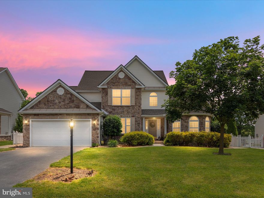 Welcome to 246 Shannon Ct, a delightful contemporary colonial style home in the sought-after established neighborhood Webber Springs, in Inwood, WV. This spacious home sweet home offers a harmonious blend of space, classic design characteristics and amenities, making it the perfect place to call home. Eye-catching curb appeal enhanced by the elegant stonework facade, lush landscaping, and surrounding stamped concrete walkways leading to the fenced rear yard. Secluded rear yard backing to common area is equally impressive, boasting a large concrete stamped patio, adorned by flowering plants and greenery. Stepping inside, you’ll find room for everyone, with a spacious floor plan comfortable for multi-generations. The enormous main level primary suite features an accent window bump out sitting area, 2 walk-in closets, and large private bath with separate vanities, step in shower, and soaker tub. Located on the other side of the main level is a private bedroom and full hall bath, great for a guest room or permanent solution to multi-generation living. Dedicated laundry room and garage entry complete that side of the main level. The centrally located gathering room features floor to ceiling stone gas fireplace with hearth and is the focal point of the main living area, offering a cozy feel to the spacious two-story, light-filled room. Step through to the kitchen with new granite counter tops, new sink, large island, double door pantry, breakfast area, and plenty of cabinetry. Beautiful formal dining room adorned with trayed ceiling, crown molding, and picture molding, and large enough for your big table and holiday dinners. Upper level offers two bedrooms, full bath, and overlooks the gathering room. Discover even more living space in the lower basement level, offering a large area for a recreation room, home gym, or entertainment, hobby room or movie room with closet, full bath, and large storage area. Newer roof, fresh paint, and new carpet finish out this complete home package. Classy home ready for all of your entertaining and living needs inside and out!