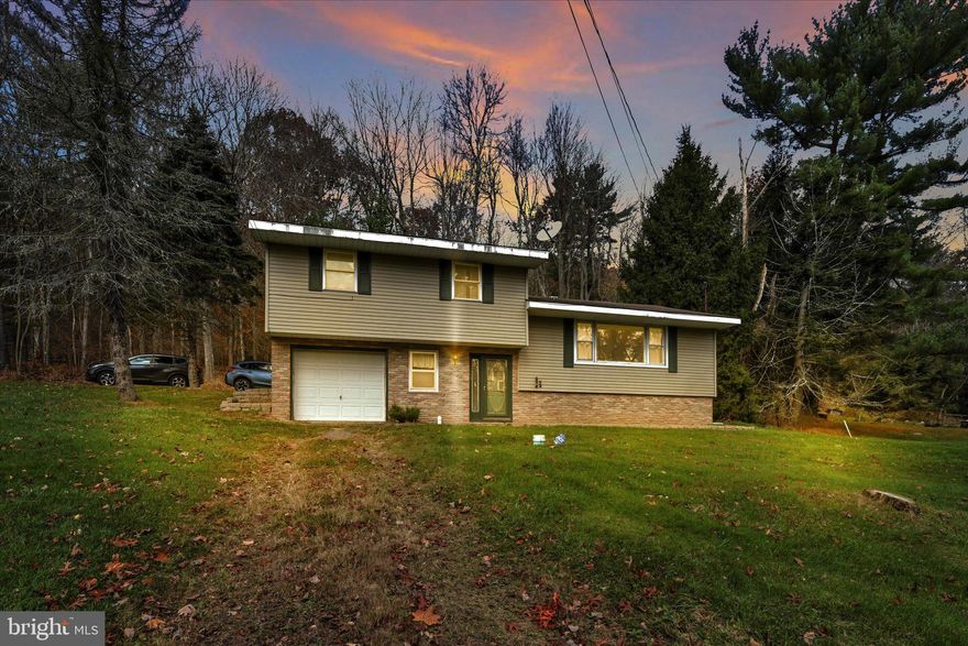 This 3-bedroom, 1.5- bath split-level home is situated on a spacious 1.55-acre hillside lot. The property boasts beautiful hardwood floors throughout, adding warmth and character to the home.  The location is ideal for outdoor enthusiasts, as it is conveniently located near the Lehigh Gorge and other outdoor recreational areas.    One of the unique features of this property is the stream that runs through it, providing a serene and peaceful atmosphere.