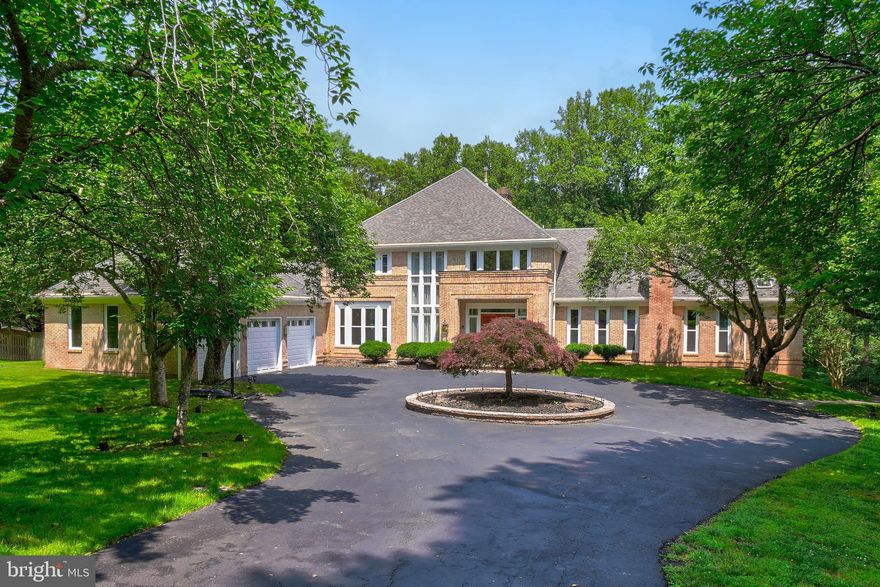 This luxurious estate, located in one of Potomac’s most desirable areas, sits on a 2-acre lot and features an elegant exterior entirely crafted from natural stone-colored brick, giving the entire structure a noble, grand, and refined appearance. Surrounded by serene woodlands, the home offers a 270-degree unobstructed glass view, immersing you in breathtaking forest scenery while providing unparalleled residential privacy.

As you enter the soaring foyer, you're greeted by floor-to-ceiling glass windows in the living room that offer an uninterrupted view of lush, untouched greenery—instantly lifting your spirits. Three skylights in both the kitchen and the living room allow abundant natural light to pour in. A dual-sided fireplace, clad in premium stone, gracefully separates the family room from the living room—maintaining distinct spaces while fostering a harmonious flow between them.

Both the living room and breakfast area feature expansive sliding glass doors that lead directly to a spacious deck. With 90-degree panoramic views and large windows, the sun-drenched breakfast nook fills your mornings with light and joy. A natural, continuously flowing stream winds through the backyard, adding a lively and auspicious touch to the tranquil garden landscape.

The multi-tiered stone patio design in the backyard, beautifully complemented by Japanese maples and a variety of plants, perfectly embodies the harmony between people and architecture, people and nature, and architecture and the natural environment.

All seven bathrooms have been newly renovated in 2019. Three HVAC systems were replaced in 2020 and 2024. All windows and deck doors on the first and second floor have been newly replaced in 2019. All of the Basement flooring has been replaced to commercial grade Vinyl flooring in 2019.  3 Garage door openers and 3 Springs and Bottom Rubbers replaced in 2023. Repainted the entire house interior and exterior in 2019.  Excellent whole house maintenance.  

Equipped with a high-capacity generator, it will automatically provide power in the event of an emergency outage, bringing great comfort and convenience to your home life.

Don't miss this exceptional and high-value home—an ideal residence designed to create a warm and happy haven for generations of family members.