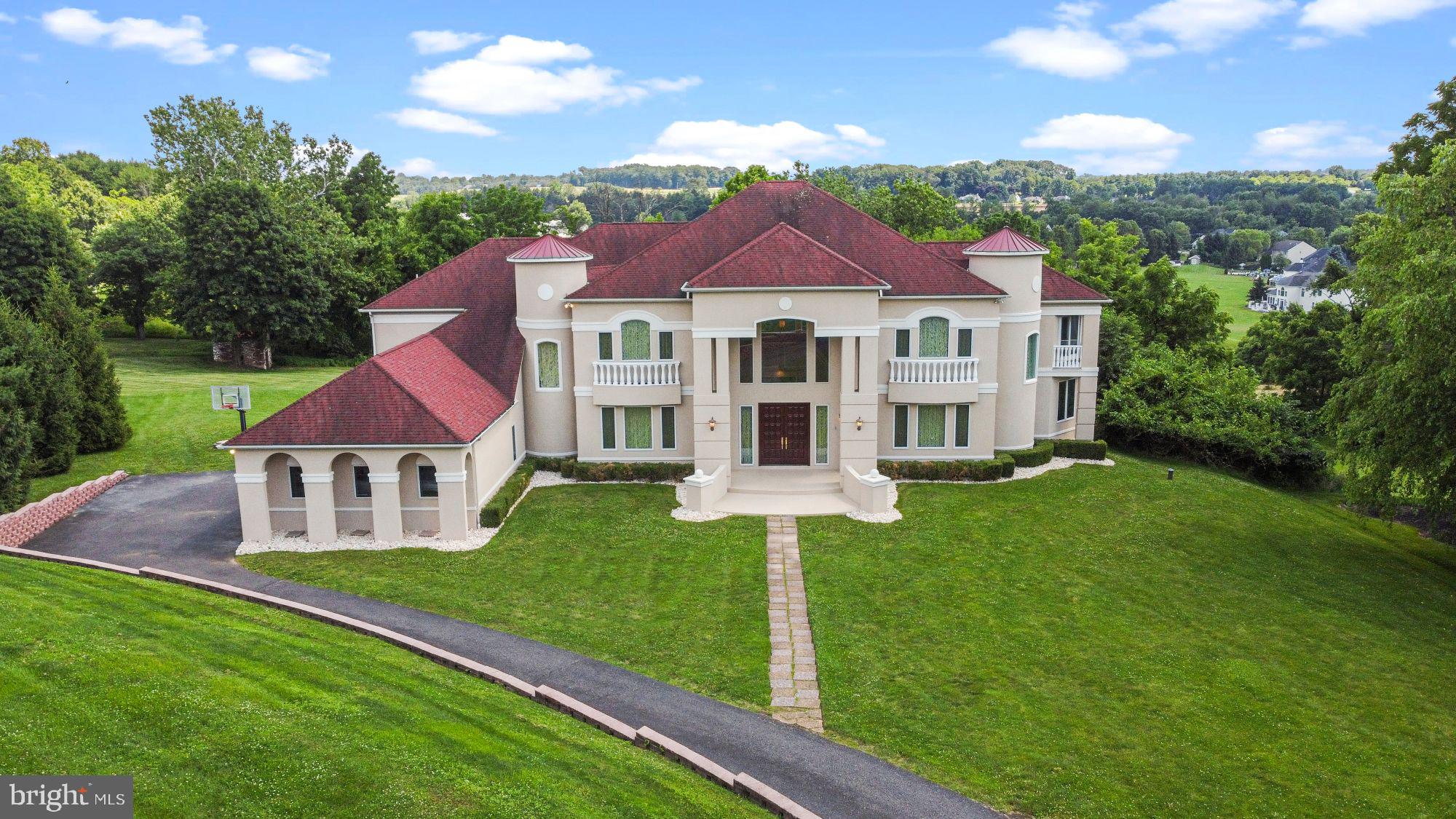 Welcome to Villa Bella Vista built in 2002 and situated on 1.3 acres of land and surrounded by greenery that could be seen from any one of the 4 balconies. This custom home boasts 6,700 sq ft of living space not including the basement. This home has 5 large bedrooms, 4 full bathrooms, 1 additional half bathroom, 1 powder room, 4 separate staircases to the 2nd floor, 2 separate staircases to the full size walk-out basement, custom-designed floor plan with 9’ ceiling throughout including the basement, 22' ceiling in the family room and foyer, all of which sits at the end of a quiet cul-de-sac in the prestigious and award-winning Council Rock School District. Custom designed Mahogany doors open to a dramatic 2-story foyer with butterfly staircase to the 2nd floor with balcony overlooking both the foyer and family room. The first room to the right is large office lined with several windows and punctuated by a spiral staircase that leads straight to the Master Bedroom. To the left of the foyer is a dining room adorned with sconces, chandelier, ceiling overhang lights and finished with intricate Brazilian hardwood flooring. Further along is a morning/breakfast room, highlighted with Pella sliding patio doors leading to a beautifully tiled deck and stairs to the backyard. The morning room is just off a magnificent custom designed world renowned bulthaup kitchen featuring stainless steel countertops, built-in appliance closet, stainless steel Gaggenau appliances including a steamer in the kitchen island next to the 1st of 2 sinks with Grohe faucets, trash compactor, two ovens, additional separate range, Sub-Zero Refrigerator, built-in Miele dishwasher, wine fridge, and two additional built-in pull-out Sub-Zero refrigerators in the island. Across the kitchen is the 4th staircase to the 2nd floor. There is also a hallway that leads to large pantry, 2 additional closets, large play room separated by a half-wall with a window to the kitchen, entrance door leads to the driveway, full-size laundry room, and 3 car garage. There is a staircase with direct access into the basement from the garage. Across the pantry is a spec’d out elevator shaft that spans all 3 floors but is currently used as closet space. Walking back you’ll pass the foyer on your right and enter the media room through the family room that has a gas fireplace. Both of these rooms have custom designed hardwood floor. Moving further is a powder room, with electric Toto toilet, just before an enormous 1st floor bedroom with private full bathroom and balcony. One door behind the butterfly staircase is an additional closet while another leads to the basement that houses 2 separate water heaters, 75 and 50 gallon, 3 separate highly efficient geothermal HVAC units connected to 1 of 2 wells, water softener, water treatment, and reverse osmosis systems for drinking water. One wing of the 2nd floor has the beautiful Master Bedroom that boasts 2 balconies, large master bathroom containing separate and intricate custom made Greek-theme cabinets with full height His and Her vanities, shower, Jacuzzi bathtub, linen closet, and private toilet. Across the bathroom is an enormous walk-in closet. The other wing houses the last 3 bedrooms, one of which has its own private full bathroom and closet. The other two each have a walk-in closet and share a bathtub via enhanced jack and jill connection while maintaining separate and private Italian vanities and toilets. The kitchen staircase is opposite these rooms in the hallway that also includes a direct laundry chute, mini-fridge built into the wall, storage closet, and re-purposed elevator shaft. This house has electrical run to the curb for a gate or lights, AV wiring throughout, hard-wired security system and cameras wiring around the perimeter, lightening grounding system on the roof, outside water drainage and a fire sprinkler system on all 3 floors covering all the bases for safety in your new estate!