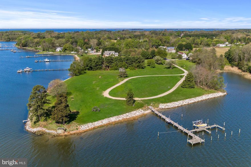 One of a kind spectacular, picturesque waterfront! Private land, sited to build home of choice. Exquisite deep waterfront,   panoramic views, pier & lift, sandy beach, duck blind, utilities underground. History was built here President Grover Cleveland's First lady Frances Cleveland lived on the property in 1920. Ready for you to build your dream home and pool! Pier & Duck Blind both convey