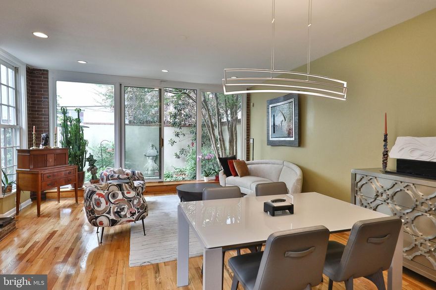 2012 Lombard Street is a home filled with glowing natural beauty. This stunning 24 foot wide 4 bedroom, 3.5 bath, features 2 outdoor spaces, 3 fireplaces, and pristine hardwood floors. Step inside the formal parlor highlighting the sweeping staircase and 10-foot ceiling. Follow the flow to the great room with an open chef’s kitchen complete with a granite top island and storage, stainless Bosch appliances, gas cooking and a glass backsplash. The counter wraps around to form a breakfast bar with seating. Continue to the living area featuring an exposed brick wall and gas fireplace. Unique to this city home is 4 windows that wrap around allowing natural light to pour in.  All eyes are drawn to the floor to ceiling glass wall entering the stunning picturesque garden. One is transformed by the tranquility and serenity of this private, Zen space.   The second level splits to 3 bedrooms. On the north side there are two bedrooms with a Jack and Jill  bathroom. The south side presents the oversized primary suite complete with high ceiling, gas fireplace, and a framed window overlooking the garden.  The abundance of storage is evident with a wall of hanging closets, overhead storage, and a walk in adjacent to the full bathroom. The third level is the perfect guest suite with 6 windows highlighting the city skyline, a cozy sitting area around the wood burning fireplace, and a full bathroom. Topping it all is a spacious roof deck lined with flower filled planters with an irrigation system. The lower level has ample storage, laundry and plumbing in place should one decide to add an additional bath.  This home, located near the Lombard Swim Club, has been loved and appreciated by the owners who have found the location convenient to so much the city has to offer. Enjoy the proximity to Schuylkill River Trail, Dog parks, Taney/Markward playground, Fitler Square, 20th street restaurants, cafes, and all of the boutiques, restaurants in Rittenhouse Square and more. Greenfield School Catchment.  Close to University of Pennsylvania Hospital and 30th street station.   Please note that the City of Philadelphia has conducted a real estate tax reassessment, effective January 1, 2023. If you have any questions or concerns about the impact of this process on the future real estate taxes for this property, you should contact the City of Philadelphia.  Owner is offering 1 year paid parking at a nearby lot with an accepted offer.