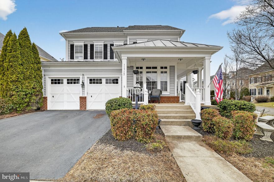 Welcome to your new  home in coveted New Bristow Village. Sited on a premium corner lot, 11712 Robert E Lee has almost 5000 sq feet and scenic views of one of the beautiful community lakes. The  grand entry with hardwood floors leads to a formal living and dining space, plus an office that makes working from home a breeze. There is a chef's kitchen opening to the den/family room with a picturesque fireplace and breakfast nook. Enjoy a large deck right off the main level that's perfect for entertaining. Stairs lead to an second bedroom suite with en-suite bath,  walk-in-closet and a Jack-n-Jill ensemble with two spacious rooms and a full bath with double sinks. The highlight of the upper level is a magnificent owner's suite that presents lighted tray ceilings, massive windows, and an opulent en suite bath with soaking tub and separate shower and WC. The lower level of the home has a large media room with built-in surround-sound, a bedroom (not to code) and full bath, as well as a kitchen with a bar and dining space.  It also has a cedar wine room with handcrafted cabinetry and a space for pool table and exercise equipment. The 2-car garage, wrap-around porch and fenced in backyard add comfort and convenience. Easy access close to 28, 66, Linton Hall/Bristow Rd and just minutes from the VRE. Schedule a showing today!