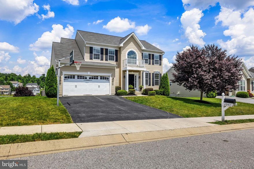 This sought after Manchester Farms spacious Colonial  is a true gem and has the possibility of an in-law suite!  Tastefully decorated and neutral throughout, this home is move-in ready and boasts tree views.  The Upper Level offers 4 BR, 2 BA and hall laundry access and the Lower Level has a full bathroom, kitchenette with island, and separate laundry room, not to mention massive walk-in closet with storage island.  The floor plan is functional no matter what your needs!  Visit the open house or schedule a private showing.  A "not-to-be-missed" home!