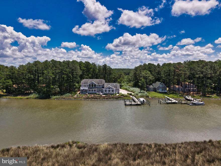 Stunning Waterfront Gem! Almost 4500 square feet, this home offers only the finest in building materials and amenities! Glass everywhere provides views that will captivate as you enjoy sights of the Little Annemessex River and beyond to the Chesapeake Bay. Large bedrooms with first floor primary with en-suite and 3 additional on the second floor. Huge Gourmet kitchen with  granite counters and solid cherry cabinets. Pela triple glaze windows provide fabulous views and energy efficiency. Soaring 2 story great room with large loft area, 2 stone gas fireplaces and Lutron Lighting throughout the home. Walk out to your private, deep water dock with boat lift. Large side attached 3 car garage for all of your Toys! Property is surrounded by Janes Island State Park and is a short drive to Ocean City and just a few hours from the DC and Baltimore metro areas! Please contact agent for complete list of amenities. See property video and 360 tour!