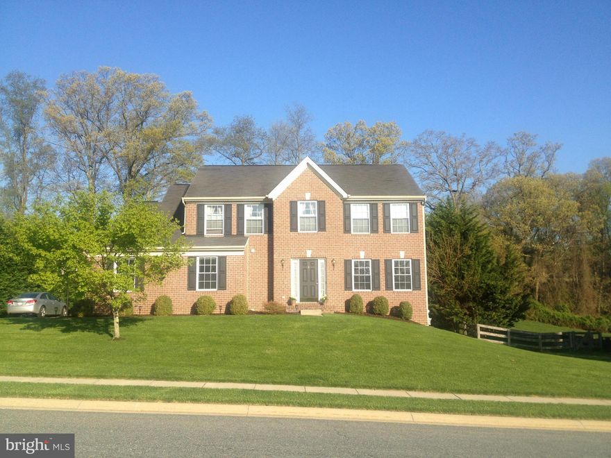 Beautiful Brick Front Colonial in sought after section of Forest Lakes. HDW flrs. Open flr plan incl upgraded eat-in kit w/ cherry cabinets, granite counter tops & s/s appliances, FR/Sun room.  Sep LR/DR. Fin LL  w/ full bath & wet bar. Large MBR w/ WIC ,sep shower/jetted tub in NEWLY UPDATED MBA. Second flr laundry. Side load gar w/ extended parking. Huge deck overlooking quiet, spacious yard.