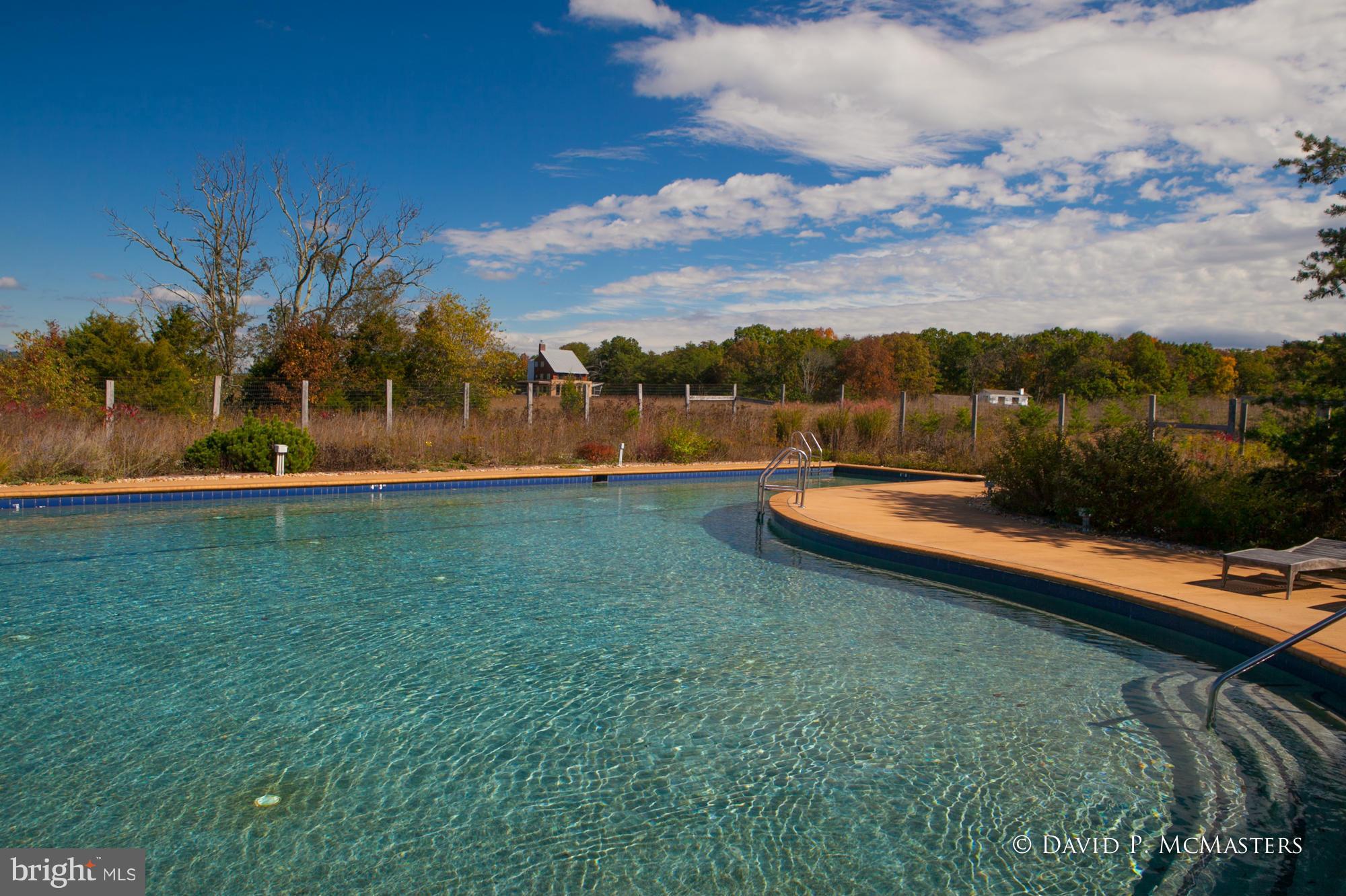 Broomgrass is an organic farm community designed to provide a rare lifestyle on 300 acres. Build a custom energy efficient home on this 1 acre lot, in a cloistered wooded private setting. Community assets include a 25 meter salt water pool, spa, barn, 1.6 miles along Back Creek, ponds. Walk, hike, farm, horseback ride, fish, canoe. Close to I-81, 20 min to MARC Train, 2 hours Washington DC.