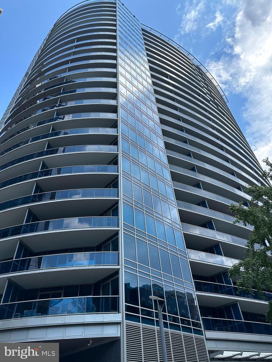 Spectacular 2 bedroom 2.5 bath penthouse-level luxury condominium in acclaimed Turnberry Tower now available! A private elevator whisks you to the 19th floor where the doors open to a private foyer leading to a 2,039 square foot, 11 foot ceiling dream home. A 400 square foot balcony spanning the width of this unit enables you to enjoy unobstructed views of Rosslyn below and Georgetown and the Potomac River to the right.  Both bedrooms and the main living area have sliding glass doors leading to this fabulous outdoor space which is far away from the current construction projects in Rosslyn. The gourmet kitchen is every chef’s dream  with Snaidero Cabinetry, granite countertops, subzero refrigerator and Miele appliances which include a five burner gas stove, built in microwave, wall oven, warming drawer, espresso/cappuccino machine and wine cooler. The powder room is conveniently located by the foyer, and the laundry room has a stacked Miele front load washer and dryer. The luxurious main living area has an open floorplan.  One side has a built-in wall unit with plenty of shelf space and room for a flat screen TV.  There is also an area which can be used as a dining room or an office/den. On either side of this great space are two en-suite bedrooms. The primary bathroom has marble floors and marble countertops, a soaking jacuzzi tub and ample shower area. The primary bedroom has two walk-in closets with Contemporaria-designed custom built shelving and drawers. The second bedroom also has a walk-in closet with Contemporaria-designed custom built shelving along with a full bath with a jacuzzi tub/shower.  Large plank Brazilian cherry wood floors grace the main living area and bedrooms. What sets this desirable floorplan apart from many at Turnberry Tower is that all rooms are spacious and have endless options since they are rectangular in shape. The unit comes with two garage spaces.  The assigned one is an extra-long one with room to store bikes, etc. and is located on parking level 4 (P4-29).  The other space is valet parked, and guests visiting you can also enjoy the valet parking amenity.  This unit comes with an oversized (14’ by 7.5’) private storage room conveniently located next to the elevator bank on the G6 level (room #BG 6-03). Turnberry Tower amenities are unmatched with white glove valet service, a 24-hour concierge, fitness center, indoor pool, theater, business center, community room, community deck and so much more. The location cannot be beat in the heart of Rosslyn close to shopping and dining and a quick walk to the Rosslyn Metro Station and Georgetown.  Come see this gorgeous home today!