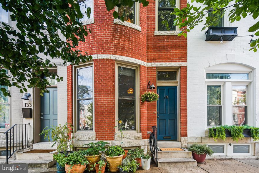 The Best of City Living Awaits You with this Charming, Brick Front, 3 Bedroom, 2 Bath, Rowhome-moments from Patterson Park! Enter into the Bright Living Room with Gas Fireplace, impressive Built-In shelving with pass through to let in natural light and gleaming Hardwood Floors that continue throughout the main level. The Gourmet Kitchen features Granite Counters, Stainless Steel appliances, Breakfast Bar, Gas Cooking and Pantry. Next, the Family Room with ceiling fan, exposed brick and pass through to the Dining room (or Home Office) with door to the rear deck, the retractable awning conveys!  Also find a Private, courtyard in the rear of the home. Make Your way upstairs to the Upper Level with Exposed Brick and a large closet for extra storage. The Primary Bedroom features hardwood flooring, ceiling fan,Walk-in closet and second large Wall closet with built-in shelving. The second bedroom and a Full Bath with Dual sink vanity, granite counters, walk-in shower, and soaking tub are also on the Upper Level.  Make Your Way Downstairs to the Third bedroom with carpeting, Full bath with walk-in shower and built ins. The Laundry Room with ample storage, including an enclosed storage space below the dining room, is also found on the Lower Level. The many upgrades to the home include, New AC Condenser and New Deck (2022), and Newer Siding.  This Home is one block from Patterson Park and close to Restaurants, Shopping and all that City Living Has to Offer! Don’t Miss It!