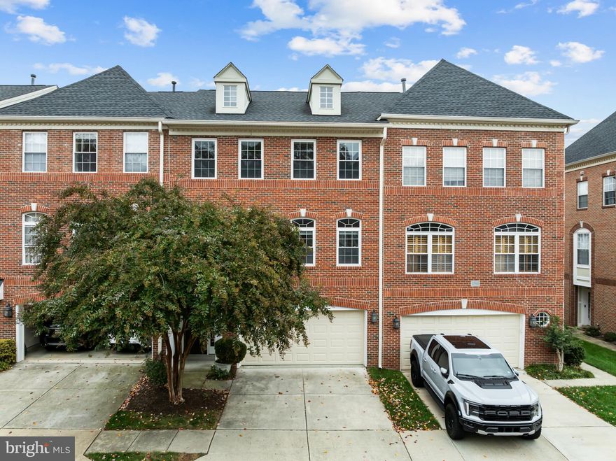 Fabulous turnkey grand townhome in  prestigious Lowes Island with over $200,000 in recent updates.  If you’re looking for luxury maintenance free living with show stopping upgrades your search is over. The kitchen has been completely remodeled with beautiful high-end cabinetry – enjoy two pantries, wide drawers, pull outs, under cabinet lighting, soft close ceiling height cabinets, stainless steel appliances, beautiful granite countertops and tiled backsplash. The primary suite is amazing with a professionally designed walk-in closet. The primary bathroom is magazine worthy with heated floors, large French soaking tub, walk-in shower with dual heads, glass tiles, oversized vanity with two sinks, marble top and lots of storage. The main level has hardwood floors in primary suite, family room and dining area.  All staircases are solid hardwood. Family room has Eco-Smart fireplace. For grilling on the deck off the kitchen there is a built-in gas line. A true 4-bedroom home is hard to find. Upstairs on the bedroom level there are three additional bedrooms, all with hardwood floors and custom designed closets. One room is a great hobby/exercise/home office room with built in cabinetry. The laundry is located on the bedroom level and has cabinetry and sink. The entry level has a gathering area with cabinetry, that has space for 2nd full size fridge. Enter into the family room which has French doors with built-in blinds and leads to outside covered patio.  The hot water heater and furnace are new in 2025, windows have been replaced. The utility room has hookups for 2nd washer dryer if desired.  Oversized garage has epoxy painted floor, built-in storage and new garage door. Special bonus – whole house central vacuum! There is plenty of visitor parking for your guests. The monthly condo fee covers nearly all exterior maintenance plus insurance so you save by buying only an HO6 insurance policy. Coverage includes concrete driveway, exterior landscaping (moving, trimming, plants and grass), roof, gutters and downspouts. Should you need it pest control inside the house that is covered too. You also get access to all the amazing Cascades amenities including 5 pools, tennis and pickleball courts, tot lots, exercise rooms, great walking trails. Walking distance to Trump National.