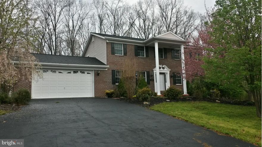 This Stately Colonial Features Hardwood Floors, 4 Bedrooms all w attached baths, Fireplaces in Family Room & Master Bedroom, Master Bedroom Suite w/ Walk in Closet, Soaking Tub and a separate Shower.  Built in Armoire W electric fireplace. Hot Tub W/ Privacy Blind. Large Recreation Room in Lower Level. 30' round above ground pool on lot that backs up to woods.**** New Carpet in Bedrooms ****