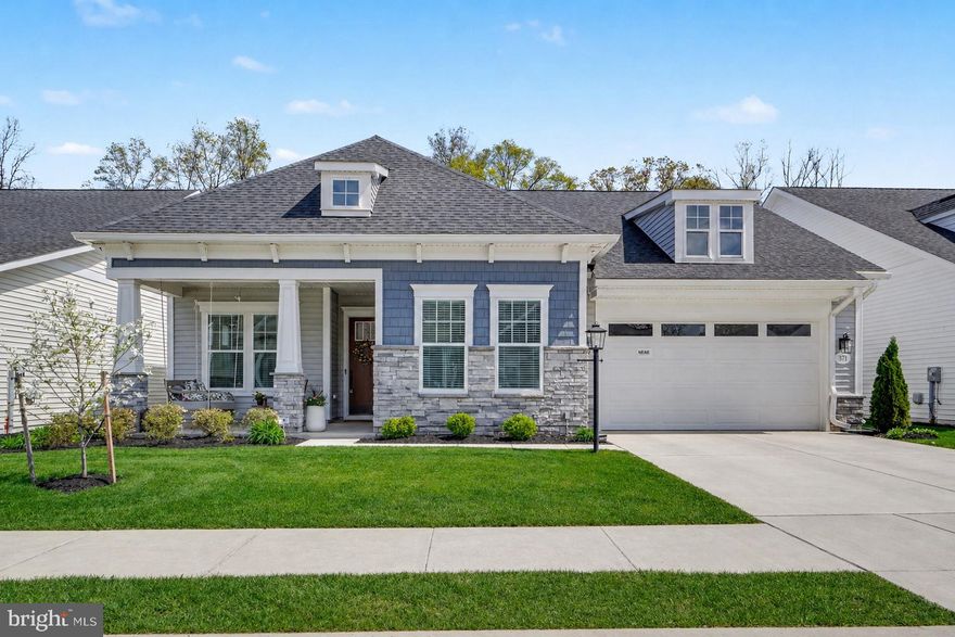 Welcome to The Quiet Creek House, a beautifully upgraded, move-in ready home in the heart of Amblebrook, a premier 55+ community designed for easy, resort-style living. Set on a premium lot backing to peaceful trees, this 2,400 square-foot home offers privacy, space, & thoughtful design throughout. From the charming front porch & timeless exterior with shaker siding, stone accents, & stately columns, to the soaring 10-foot ceilings inside, every detail feels warm & inviting.

Glass doors open to a private study that can easily serve as a third bedroom, while a guest bedroom & full bath are thoughtfully tucked away for comfort. The open-concept living area is anchored by a stunning kitchen with an oversized quartz island, KitchenAid gourmet appliances, & farmhouse sink. A butler’s pantry & spacious walk-in pantry provide exceptional storage, along with abundant cabinetry throughout. The subway tile backsplash extends all the way to the ceiling, adding a timeless designer touch. The kitchen flows seamlessly into a light-filled dining area, an open living room with a gas fireplace & custom built-ins, creating the perfect setting for both everyday living & entertaining.

The expanded primary suite is a true retreat. A custom trim accent wall adds character & warmth to the space. The ensuite bath features dual oversized vanities, a large tiled shower, & a private water closet. An impressive walk-in closet offers generous storage & connects directly to the laundry room, complete with built-ins, granite countertops, & a utility sink.

A heated four-season room extends your living space year-round. It features luxury vinyl plank flooring and stunning floor-to-ceiling windows that fill the space with natural light. Step outside to a fenced backyard featuring a beautifully hardscaped patio with a gas line ready for summer grilling. A full yard sprinkler system keeps the landscaping lush and low-maintenance.

 Additional highlights include an oversized two-car garage & a dedicated bulk storage room with built-in shelving for exceptional organization.

With indoor and outdoor resort-style pools, pickleball courts, a coffee shop, a state-of-the-art fitness center, and weekly social activities, life at Amblebrook truly feels like a vacation every day. Come experience the stunning details for yourself and schedule your private tour today.